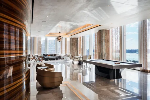 a room with lots of furniture and a large window