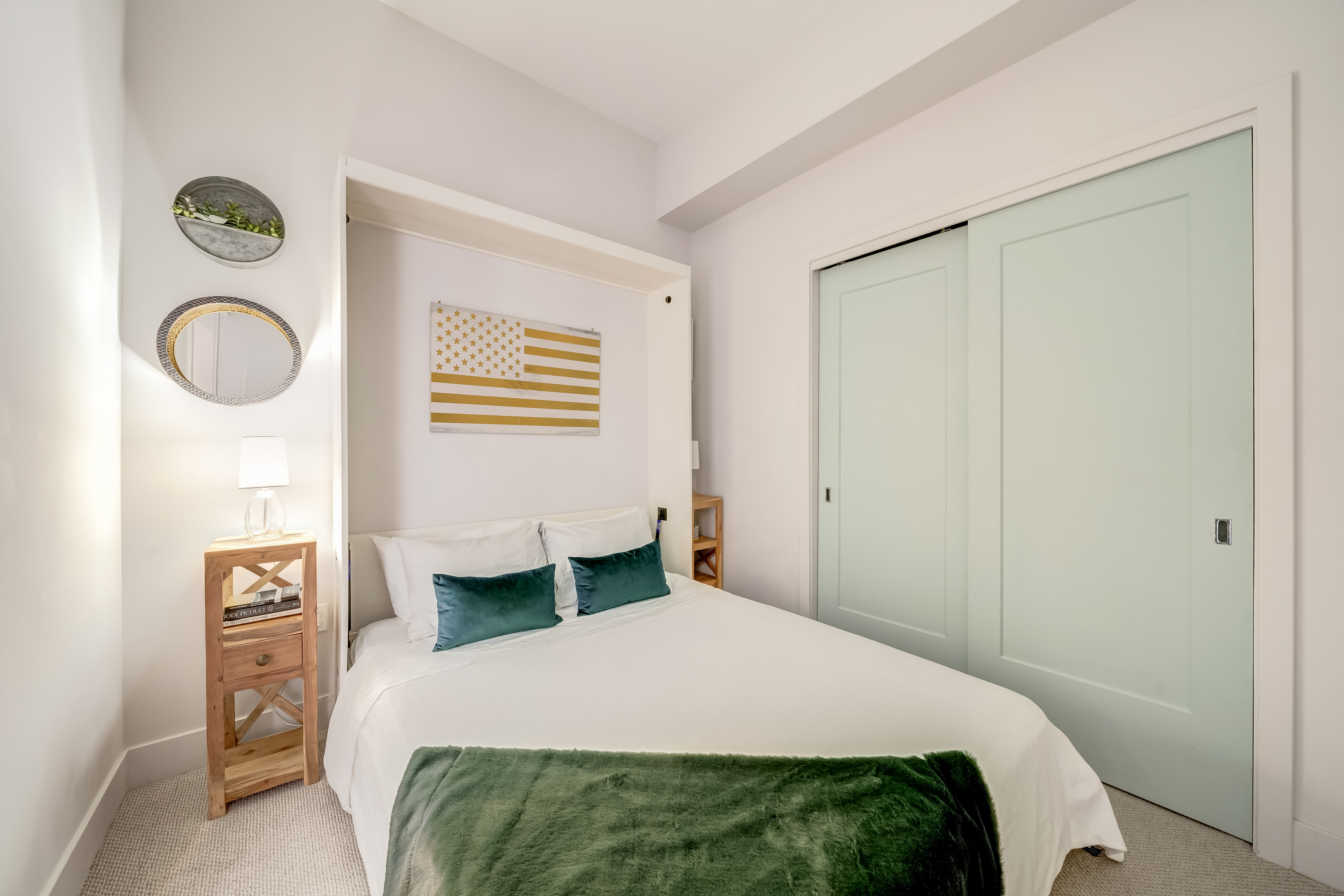 45 Sutton Square Southwest, Unit PH10 Washington, DC 20024 - Photo 30 of 44 a bedroom with a bed and wooden floor