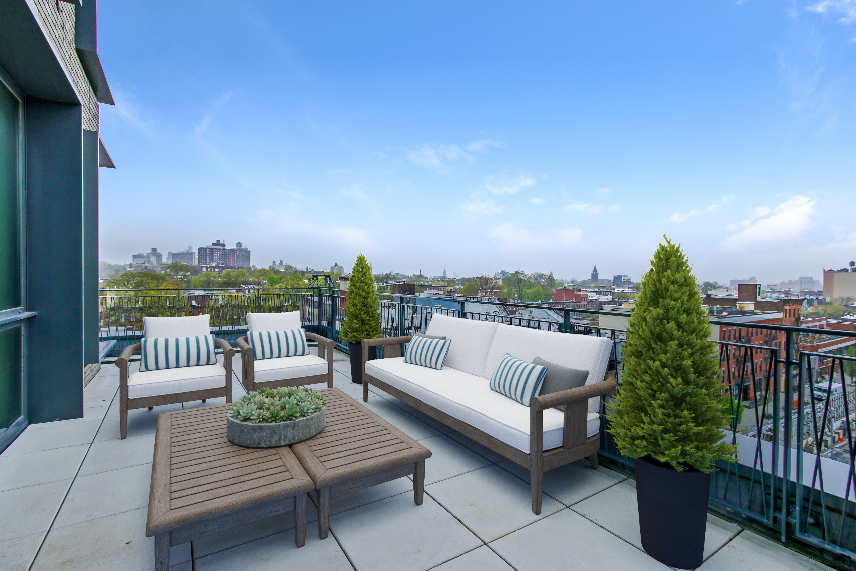 550 Vanderbilt Avenue, Unit 630 Brooklyn, NY 11238 - Photo 9 of 10 a roof deck with couches and potted plants