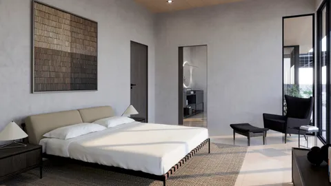 a bedroom with a bed a table and painting