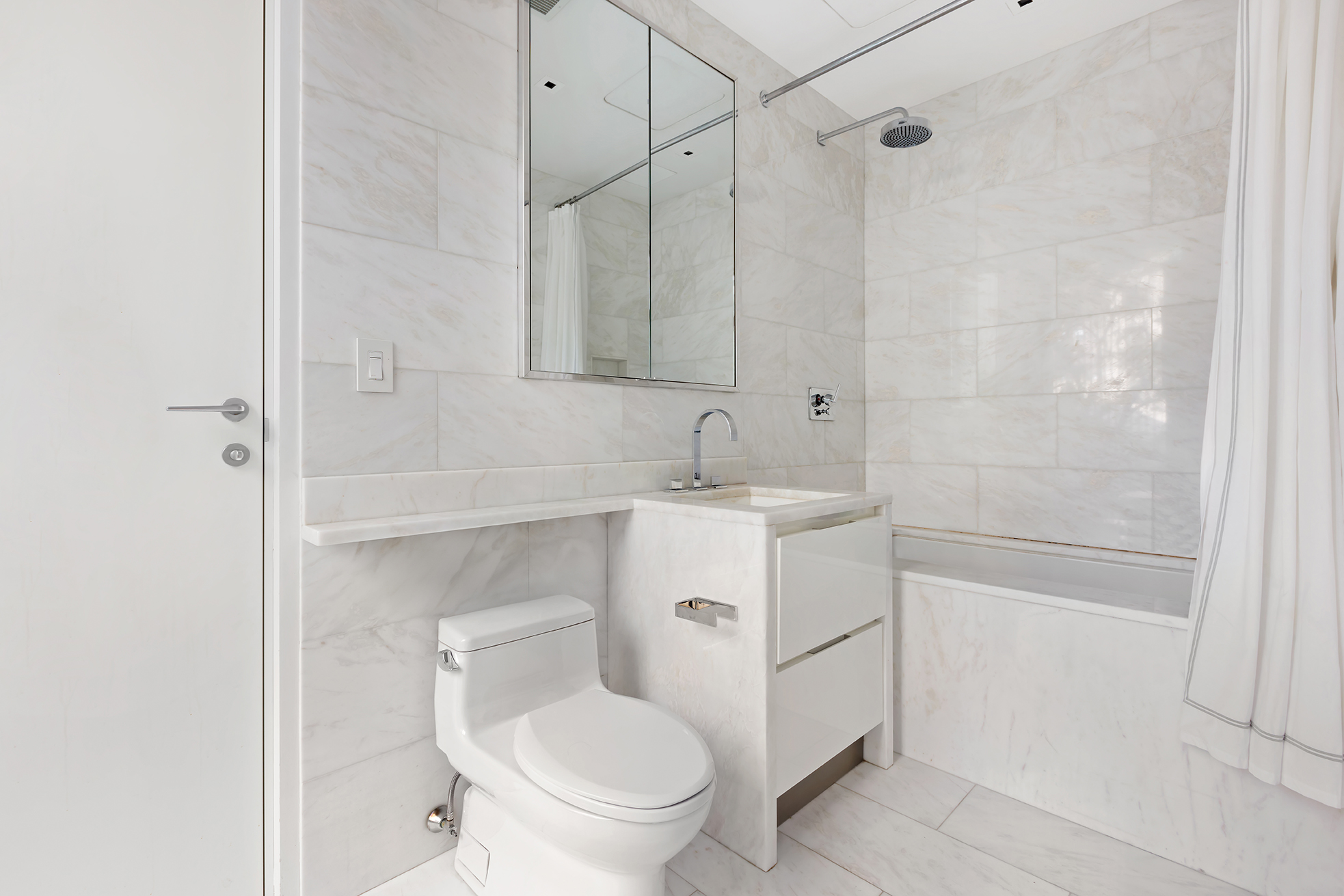 1055 Park Avenue, Unit 1 Manhattan, NY 10028 - Photo 15 of 19 a bathroom with a sink a toilet and shower