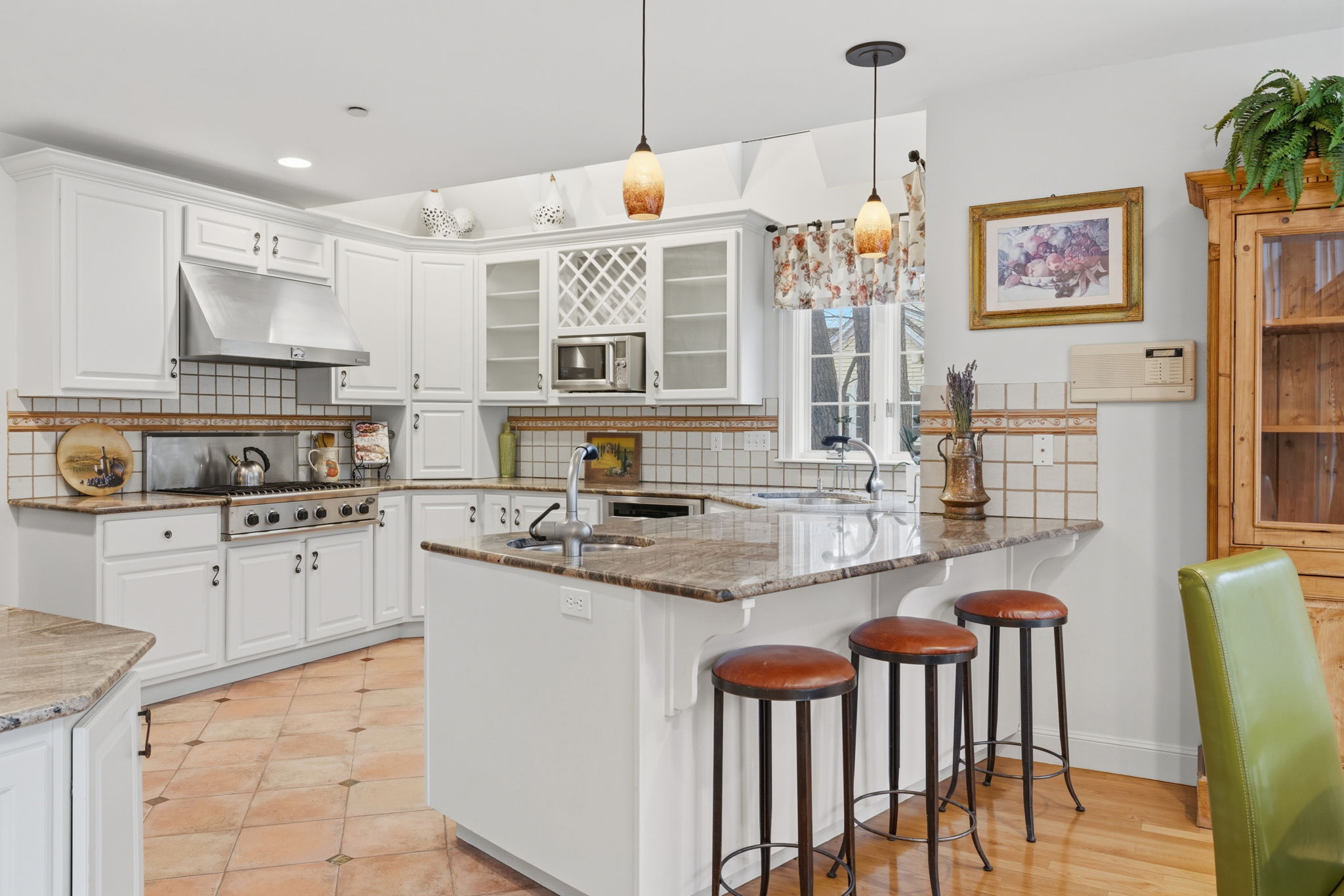 20 Marshall Path Acton, MA 01720 - Photo 7 of 19 a kitchen with stainless steel appliances granite countertop a stove a sink and a refrigerator