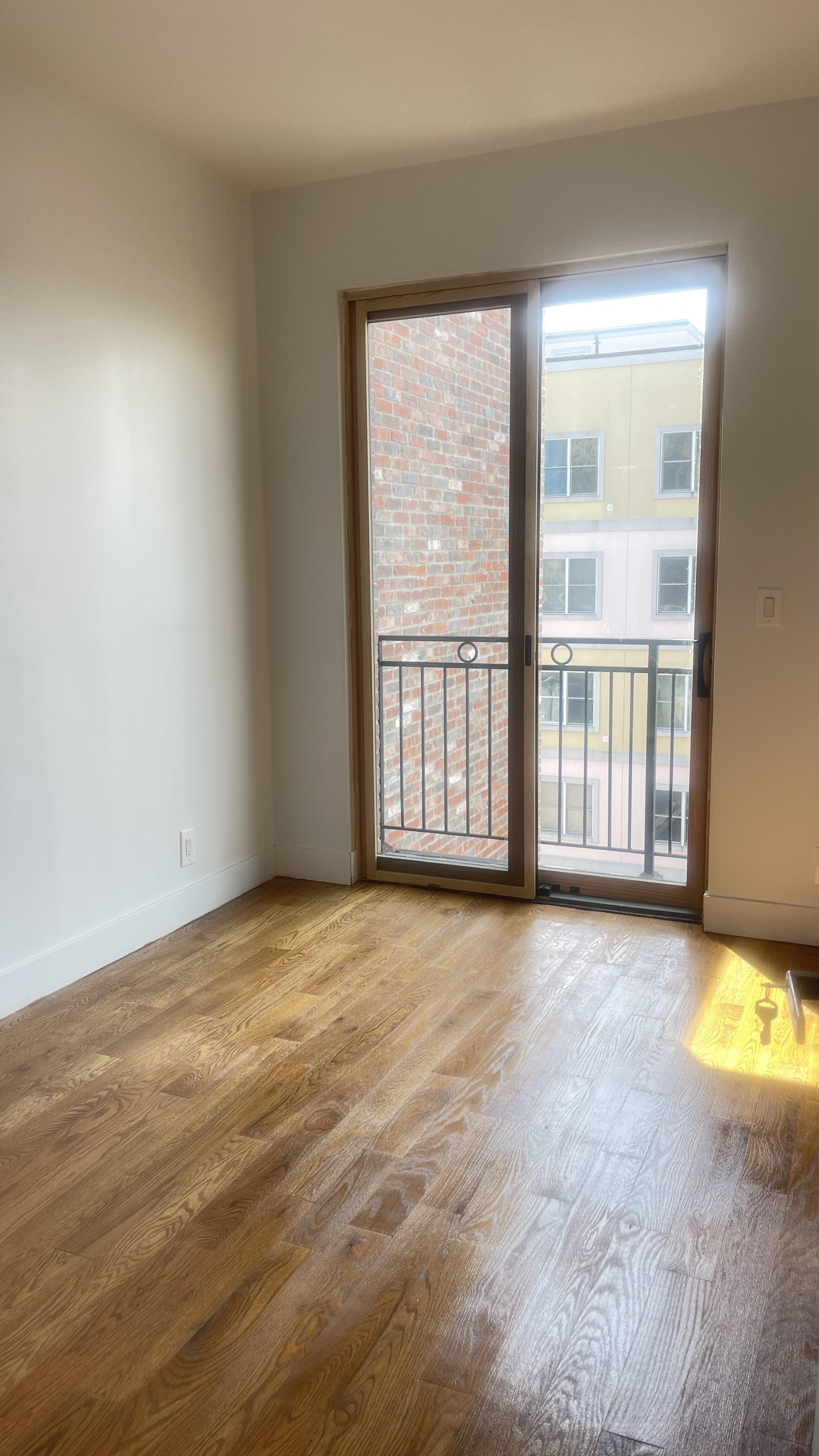 1010 Gates Avenue, Unit 6C Brooklyn, NY 11221 - Photo 6 of 9 a view of an empty room with a window