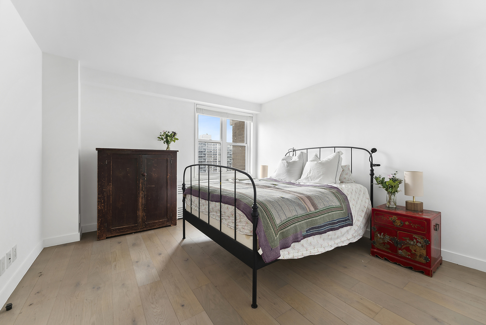 175 West 95th Street, Unit 18G Manhattan, NY 10025 - Photo 4 of 14 a bedroom with a bed and window