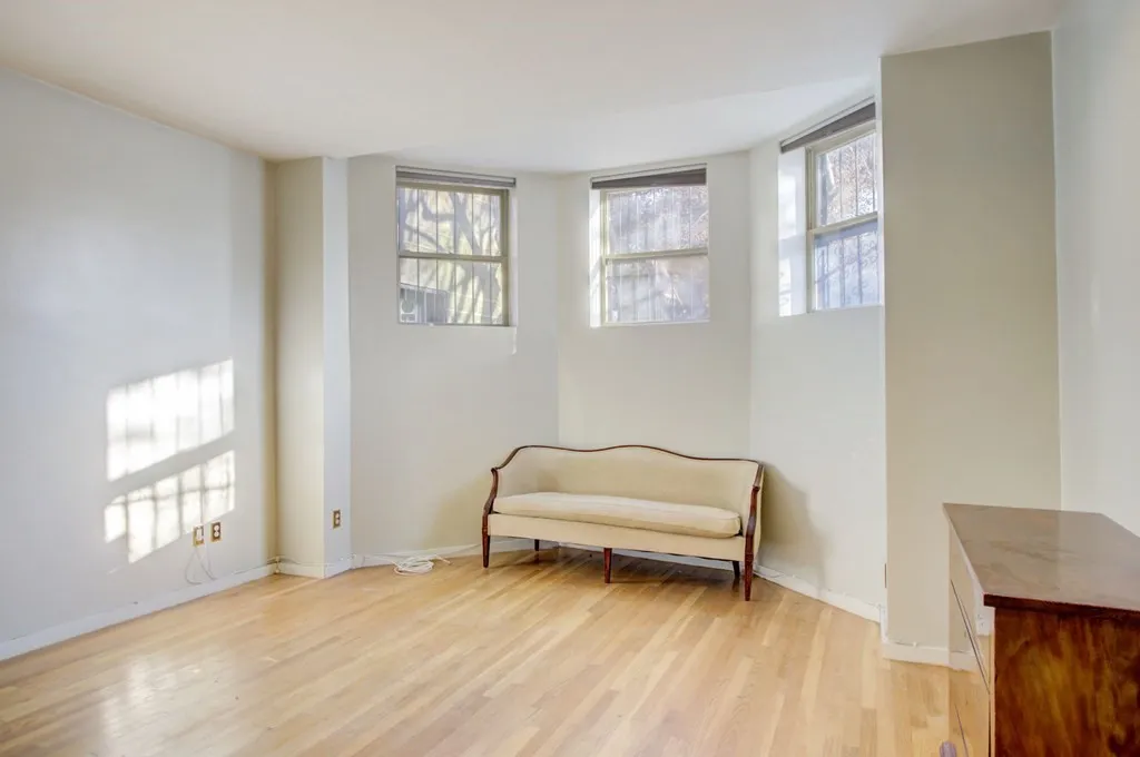 a room with window and a wooden floor