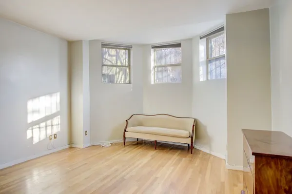 a room with window and a wooden floor