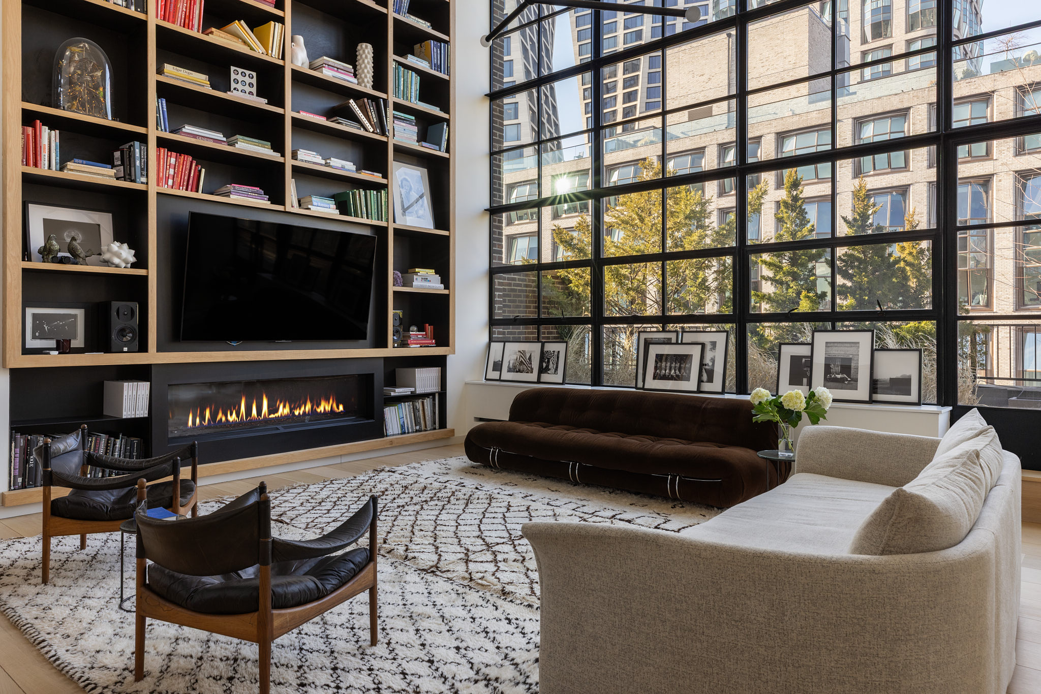 456 West 19th Street, Unit PHH Manhattan, NY 10011 - Photo 1 of 21 a living room with furniture and a flat screen tv