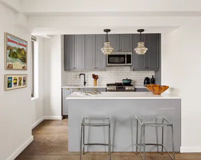 a kitchen with a sink cabinets and window