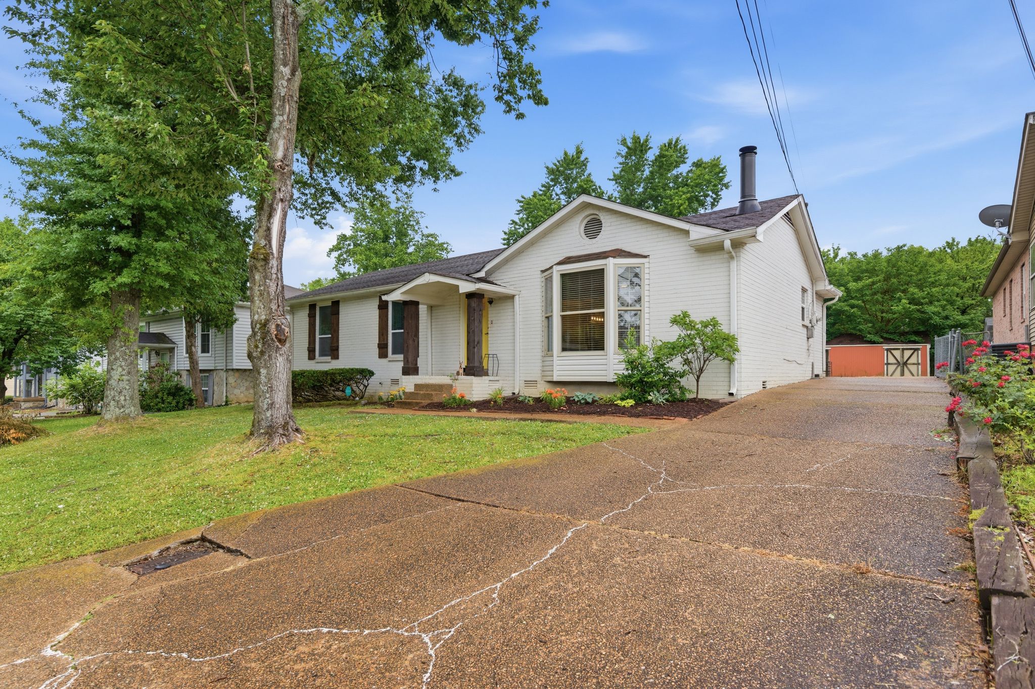 307 Paragon Mills Road Nashville, TN 37211 - Photo 24 of 29 a front view of a house with a yard and garage