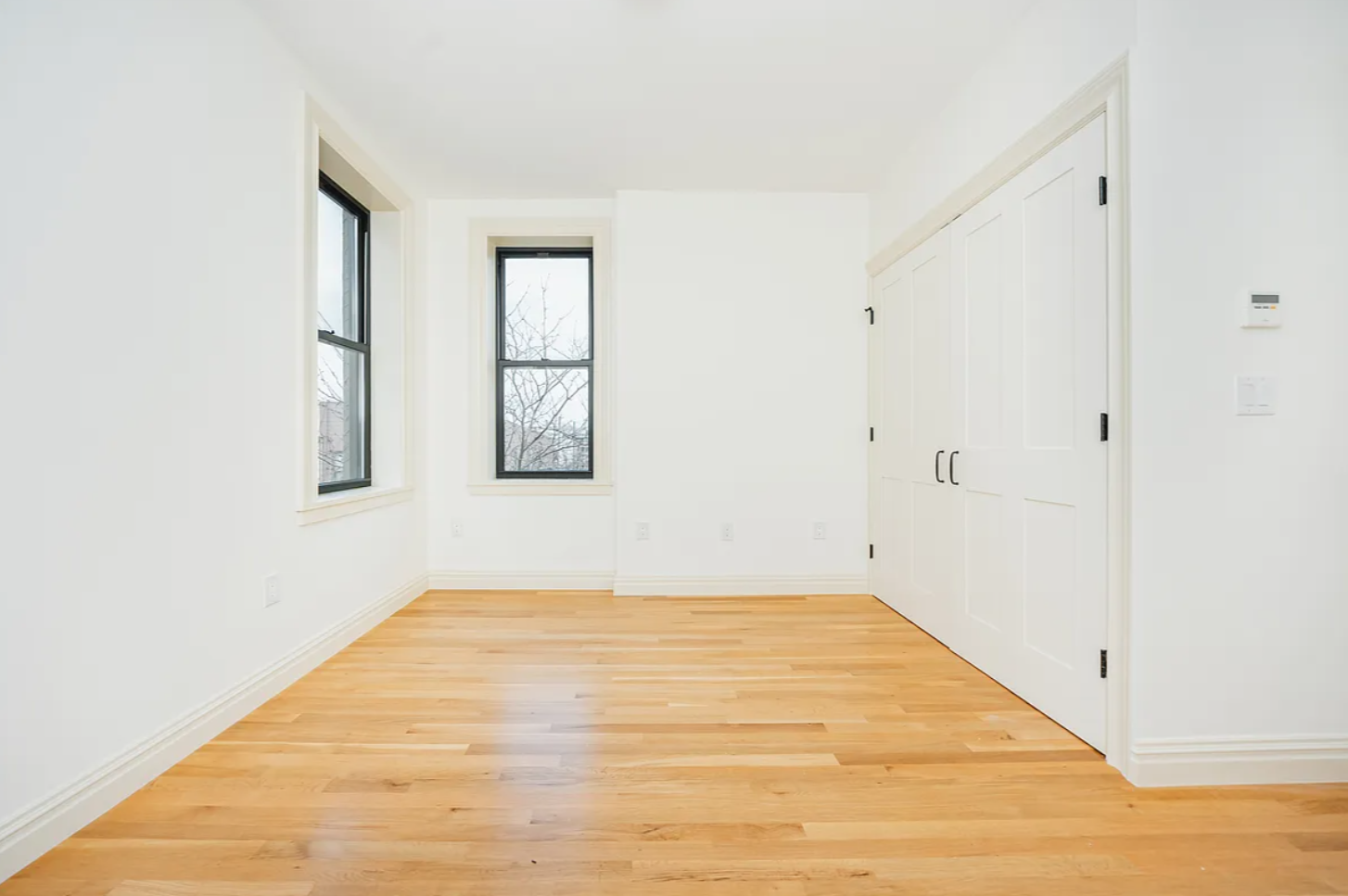68-38 Forest Avenue, Unit 3R Queens, NY 11385 - Photo 10 of 15 a view of empty room with window