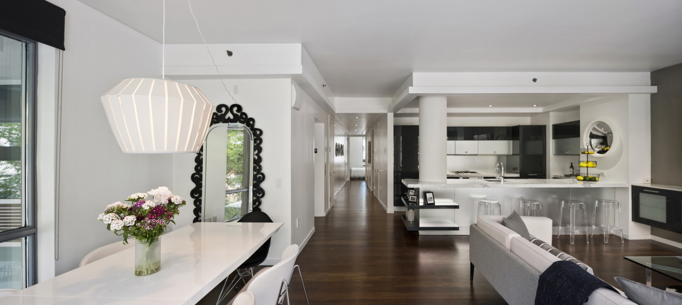 444 West 19th Street, Unit 201 Manhattan, NY 10011 - Photo 5 of 13 a living room with furniture and a chandelier