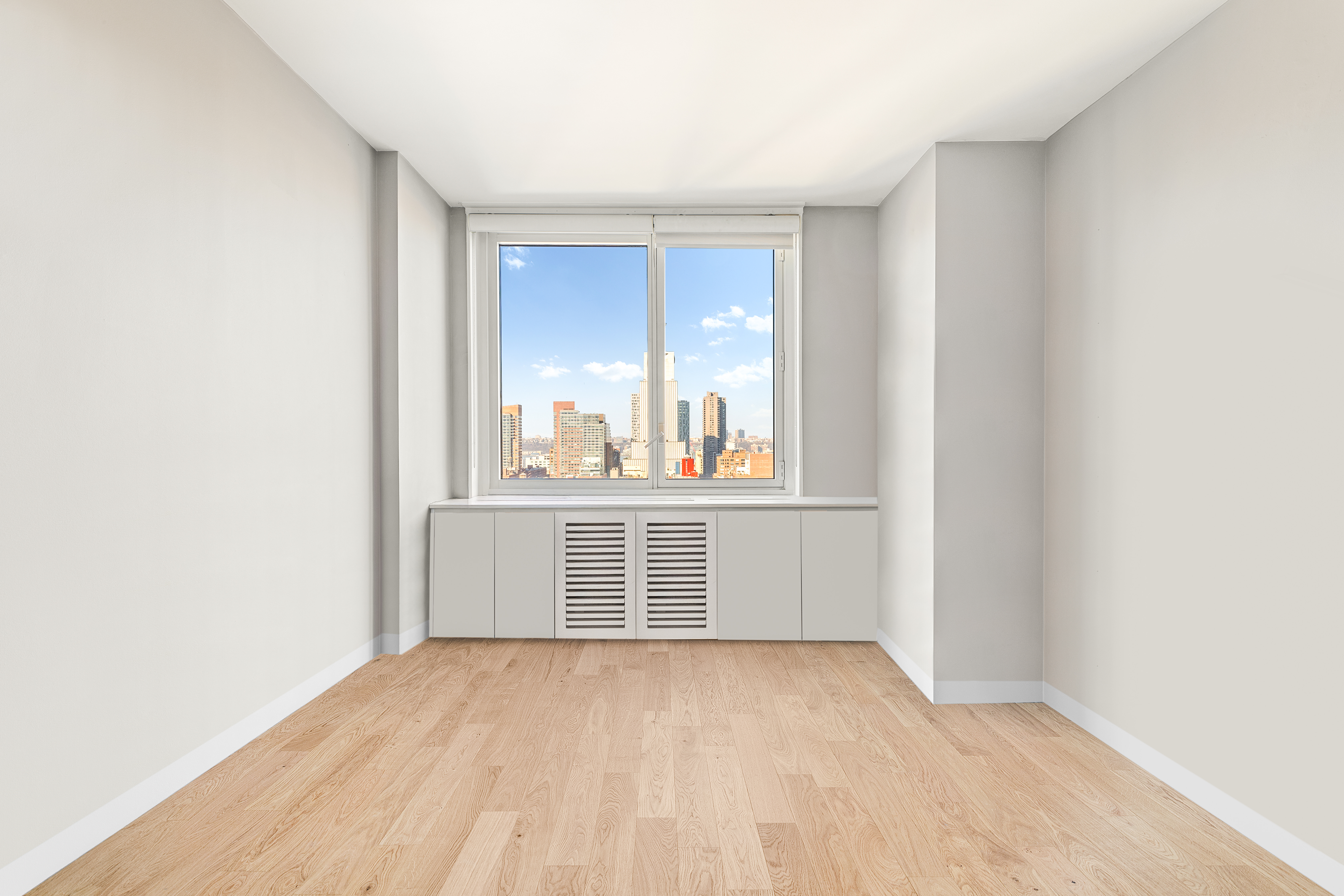 301 West 53rd Street, Unit 16D Manhattan, NY 10019 - Photo 6 of 16 a view of an empty room with a window