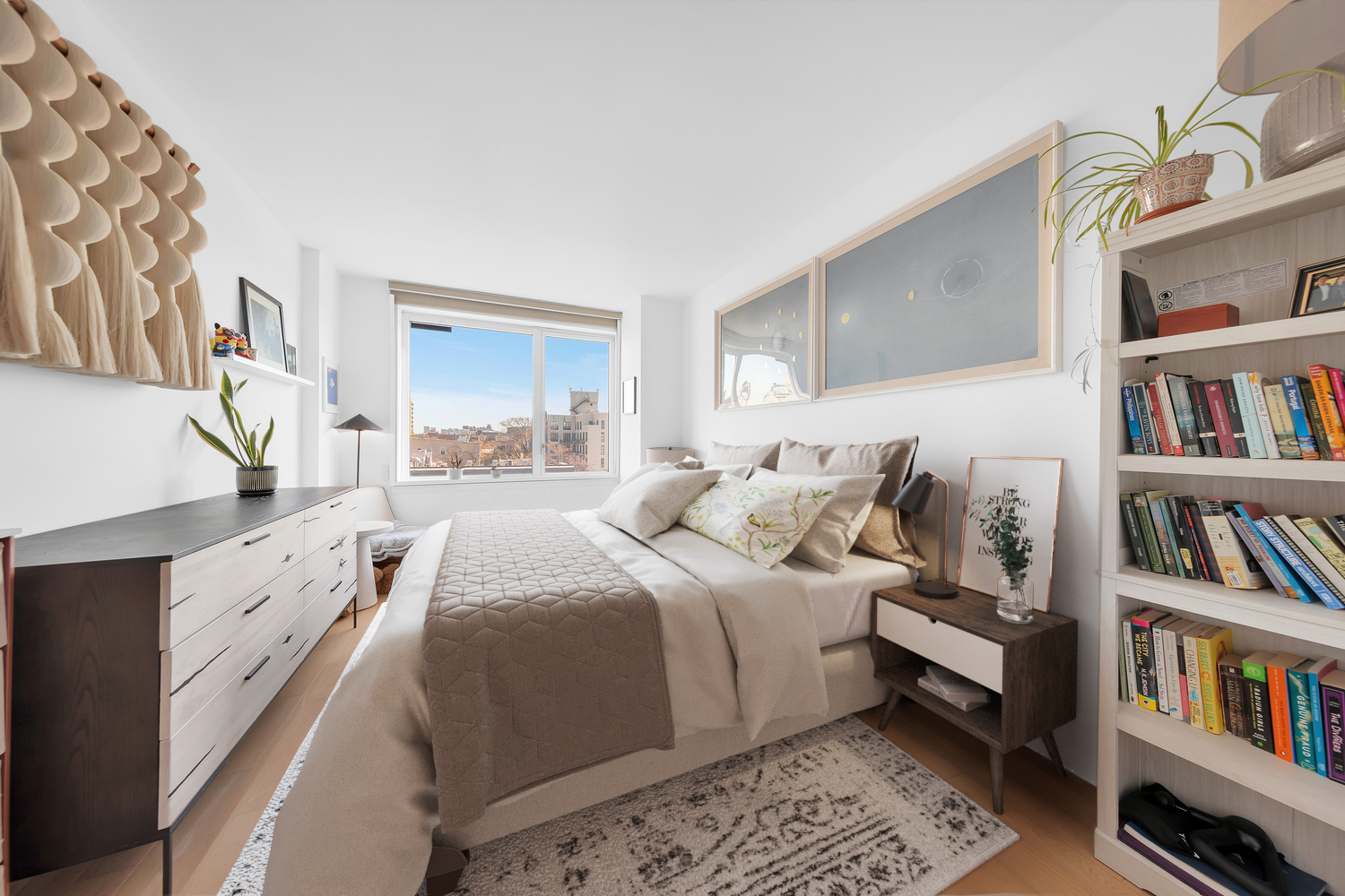 34 North 7th Street, Unit 6Y Brooklyn, NY 11249 - Photo 5 of 20 a large bedroom with a bed and a book shelf