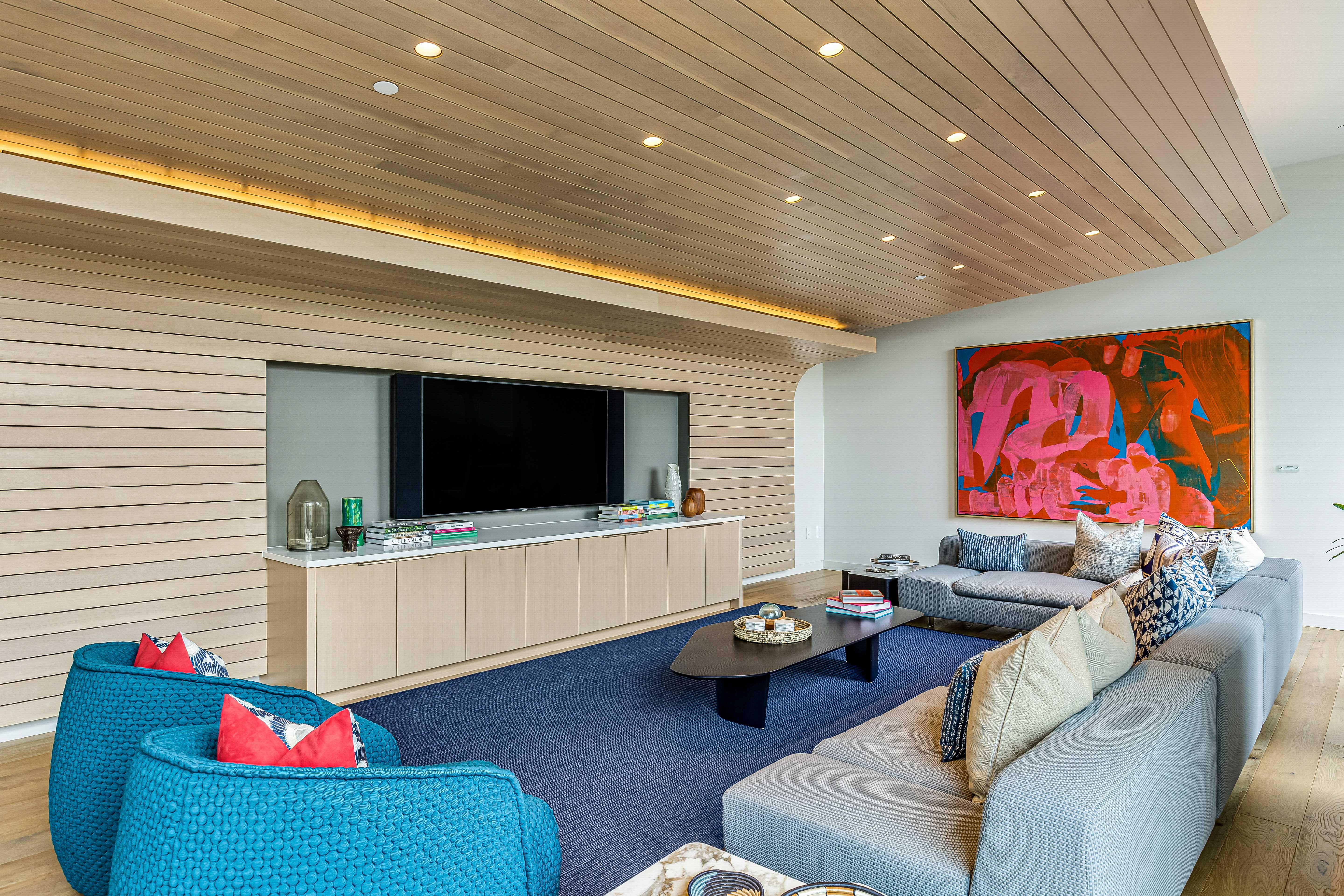 1001 Queen Street Honolulu, HI 96814 - Photo 23 of 29 a living room with furniture and a flat screen tv