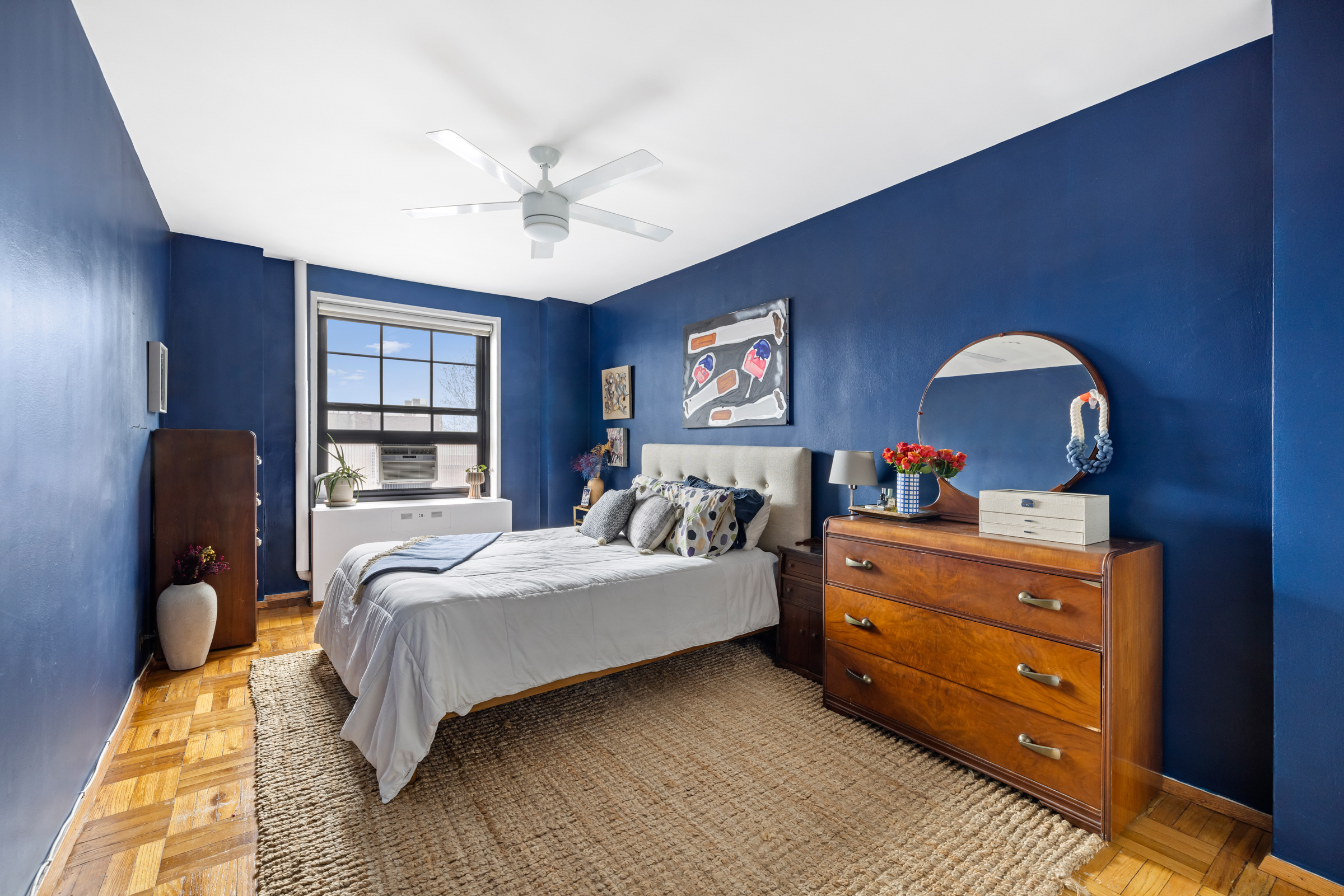 325 Clinton Avenue, Unit 7A Brooklyn, NY 11205 - Photo 7 of 13 a bedroom with a bed and a chandelier