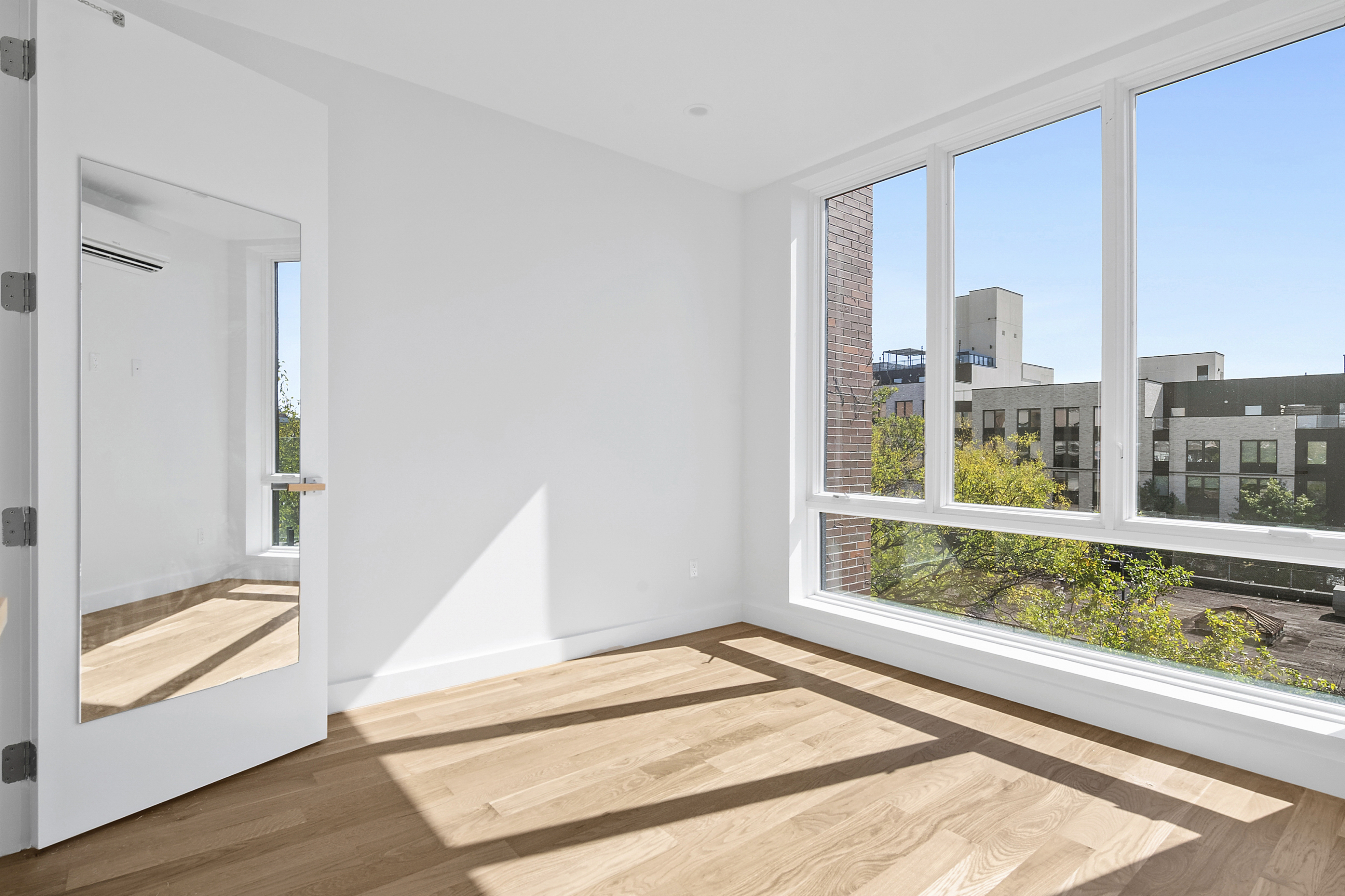 212 Montrose Avenue, Unit 3F Brooklyn, NY 11206 - Photo 3 of 9 a view of an empty room and window