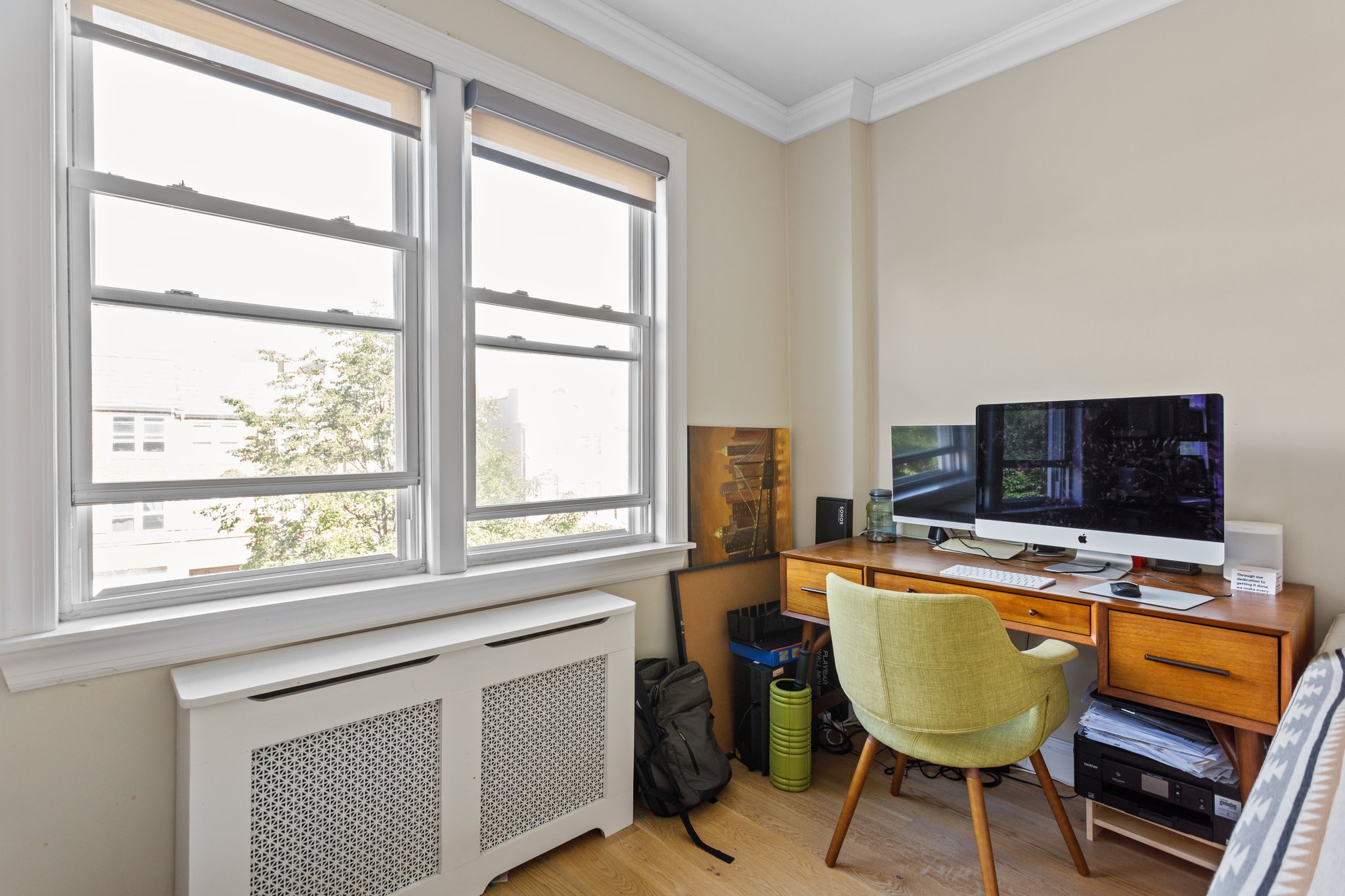 22-45 47th Street, Unit 3 Queens, NY 11105 - Photo 5 of 14 a view of a workspace with furniture and a window