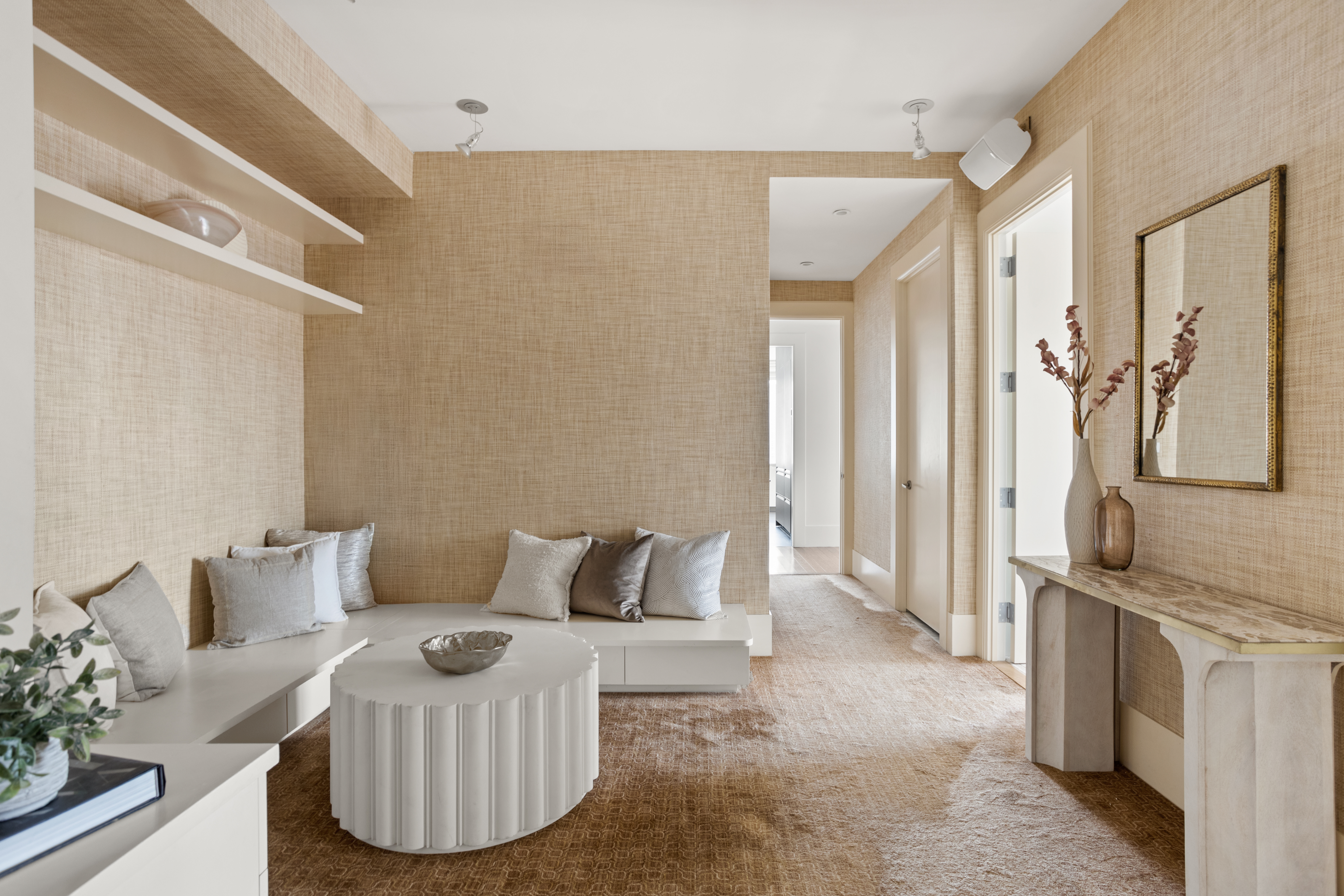 255 East 74th Street, Unit 21B Manhattan, NY 10021 - Photo 11 of 40 a living room with furniture a fireplace and a flat tv screen