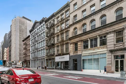 a cars parked in front of a building