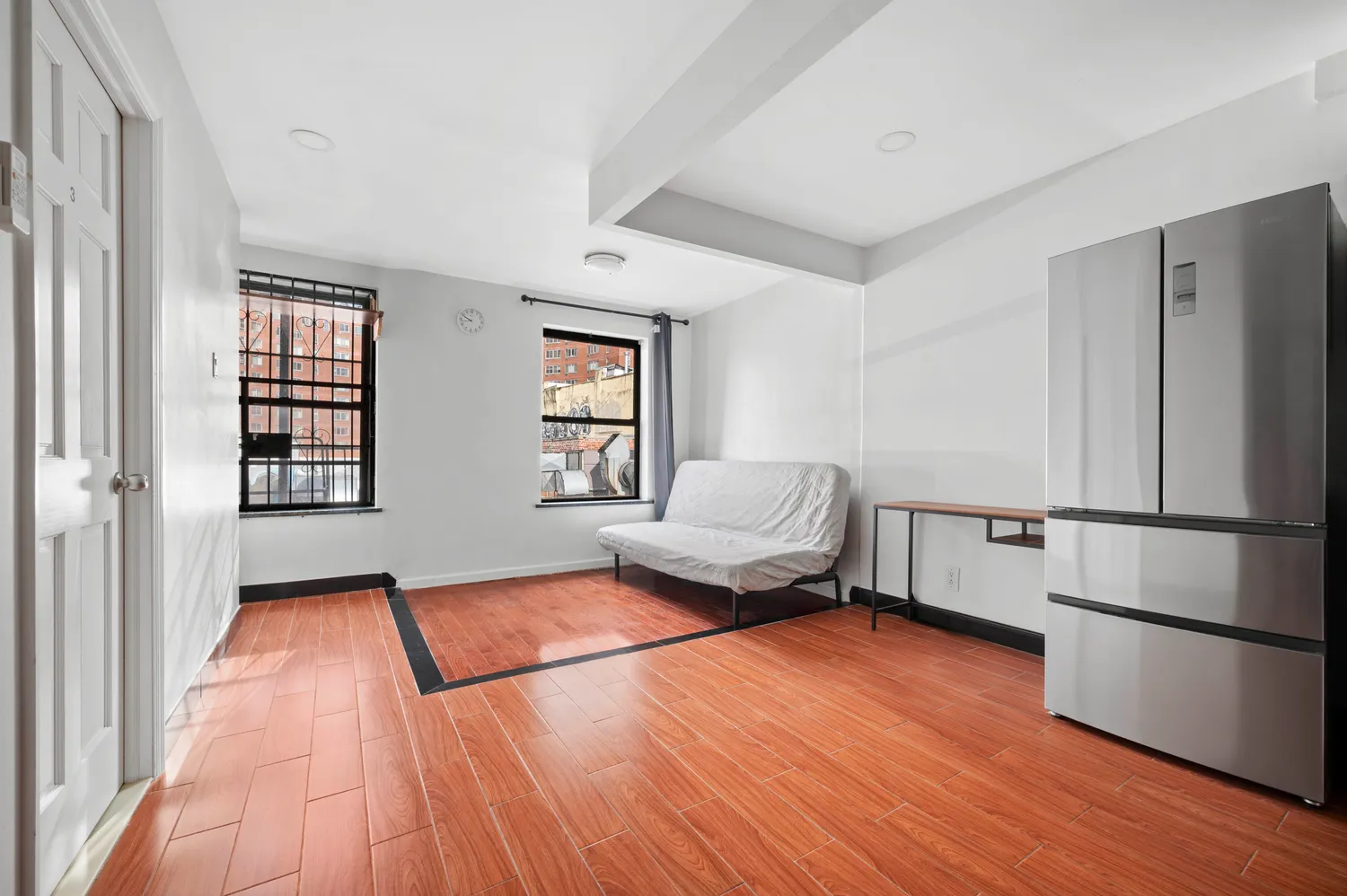 a kitchen with a refrigerator and a window