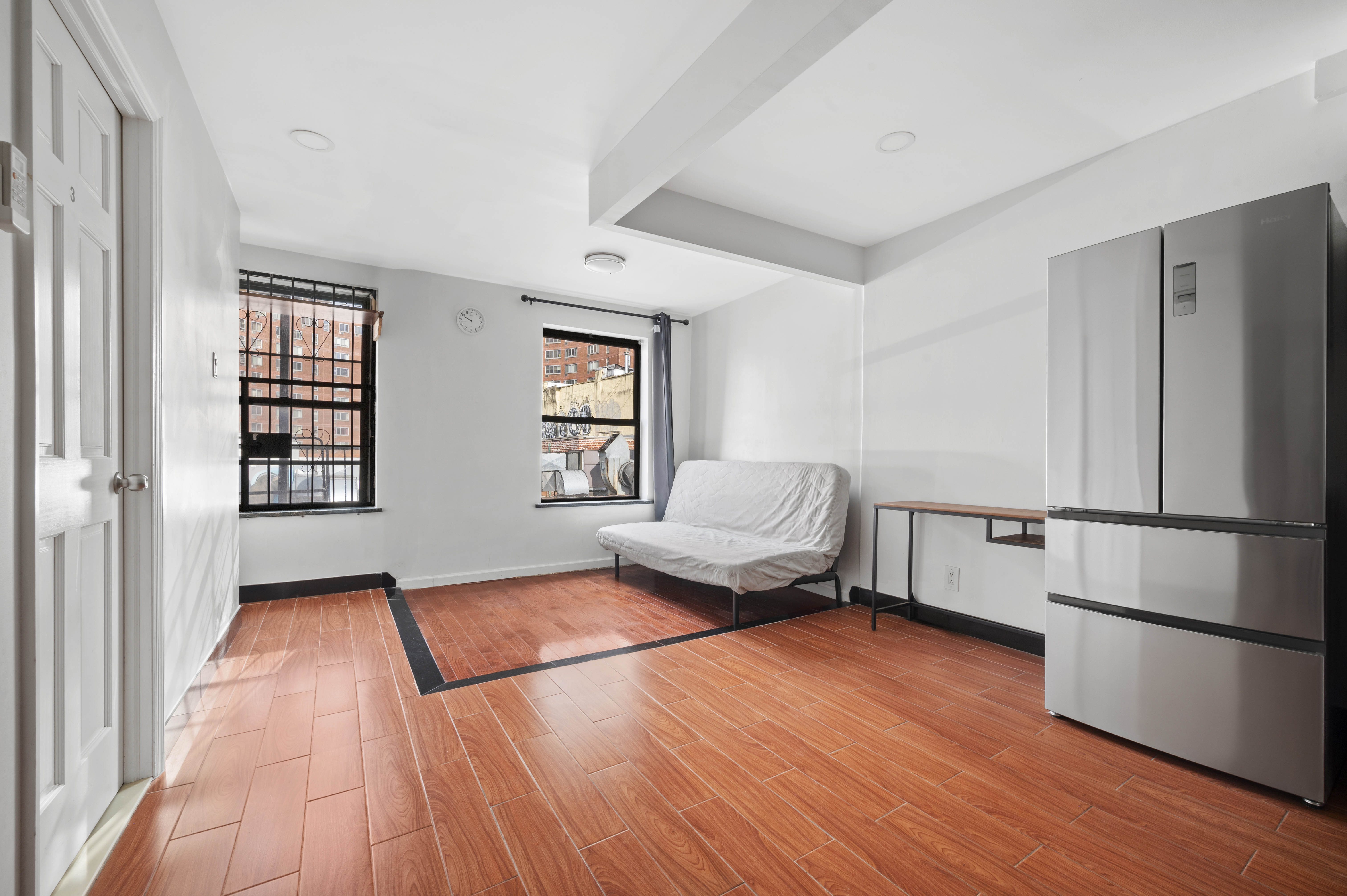 a kitchen with a refrigerator and a window