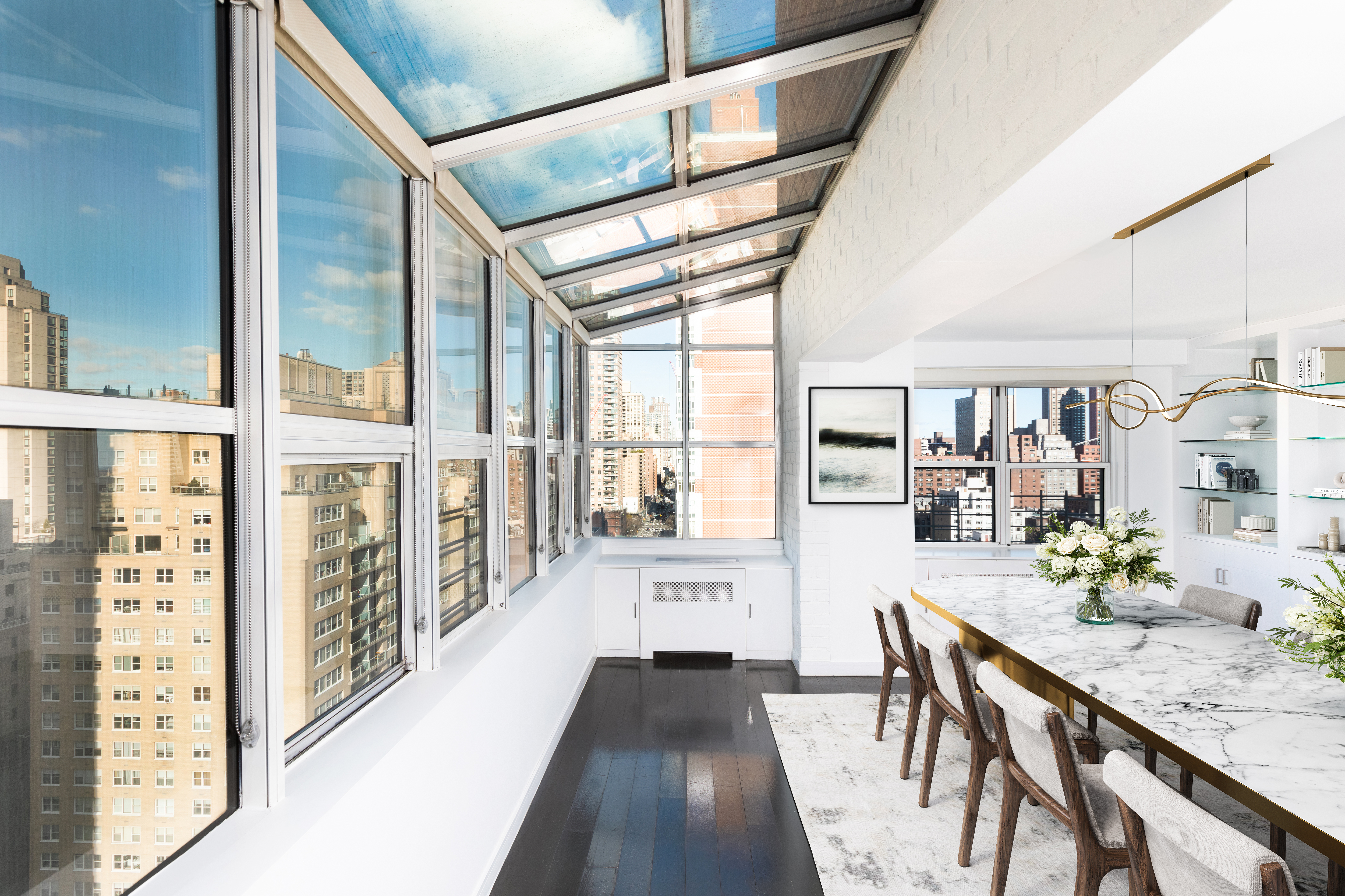 401 East 74th Street, Unit 20F Manhattan, NY 10021 - Photo 4 of 22 a view of a hallway with furniture and wooden floor