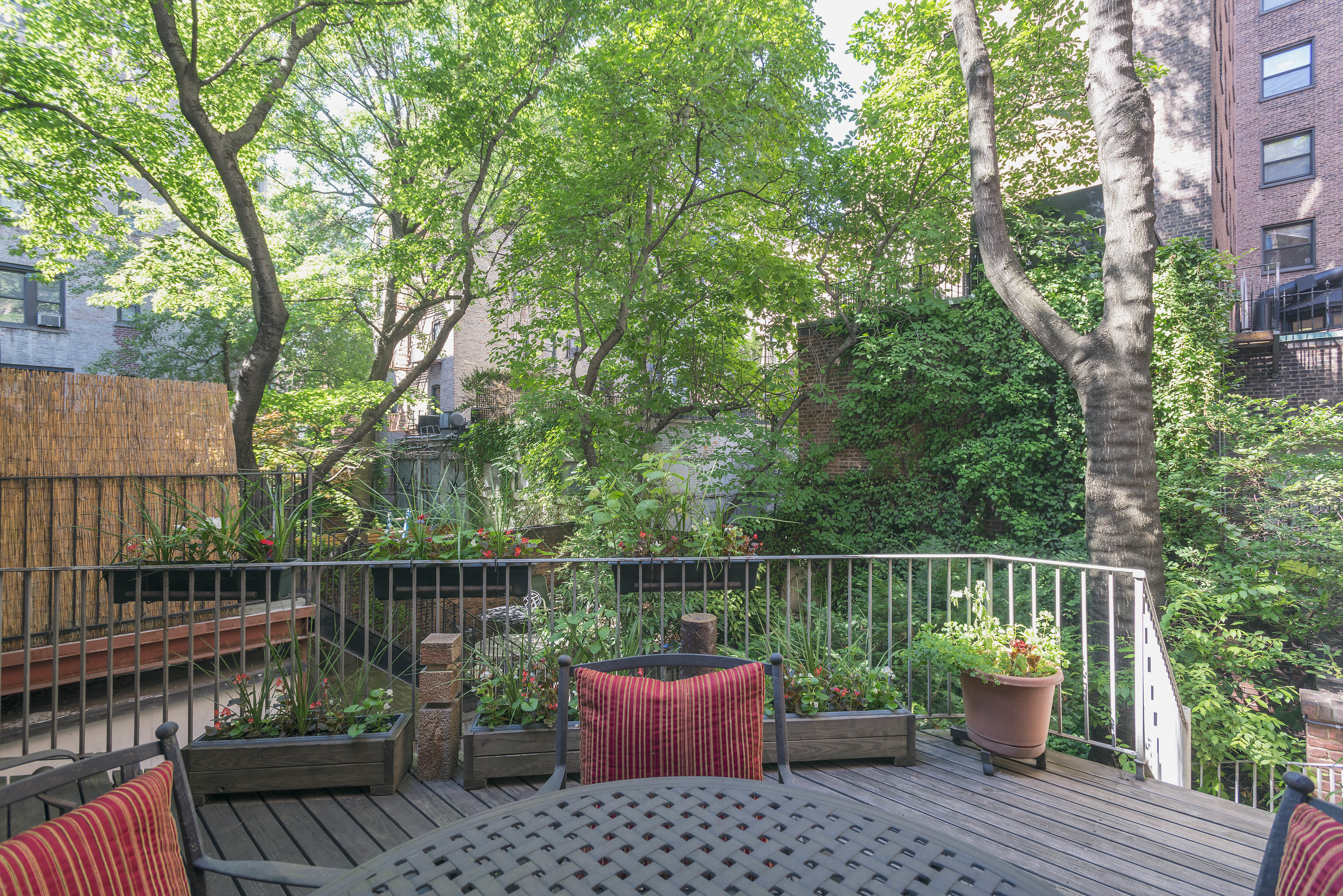 127 West 12th Street Manhattan, NY 10011 - Photo 5 of 8 a view of a deck with two chair and wooden floor