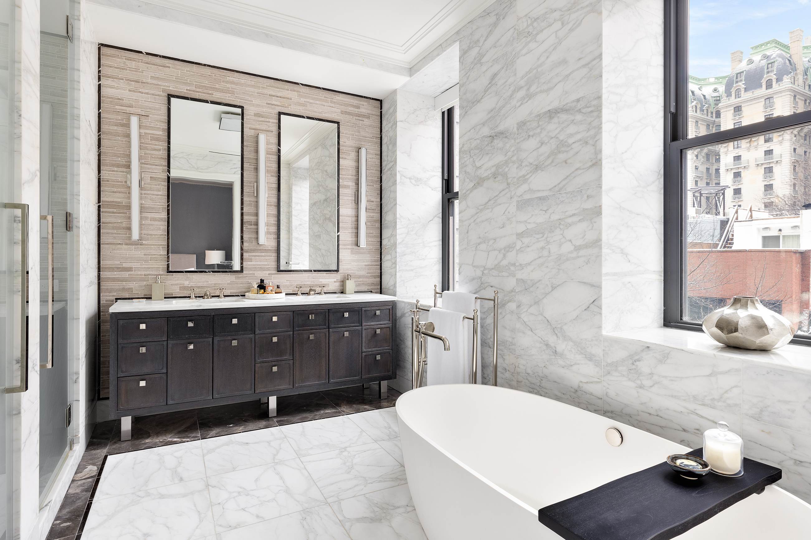 235 West 75th Street, Unit 505 Manhattan, NY 10023 - Photo 8 of 23 a bathroom with a tub sink and mirror