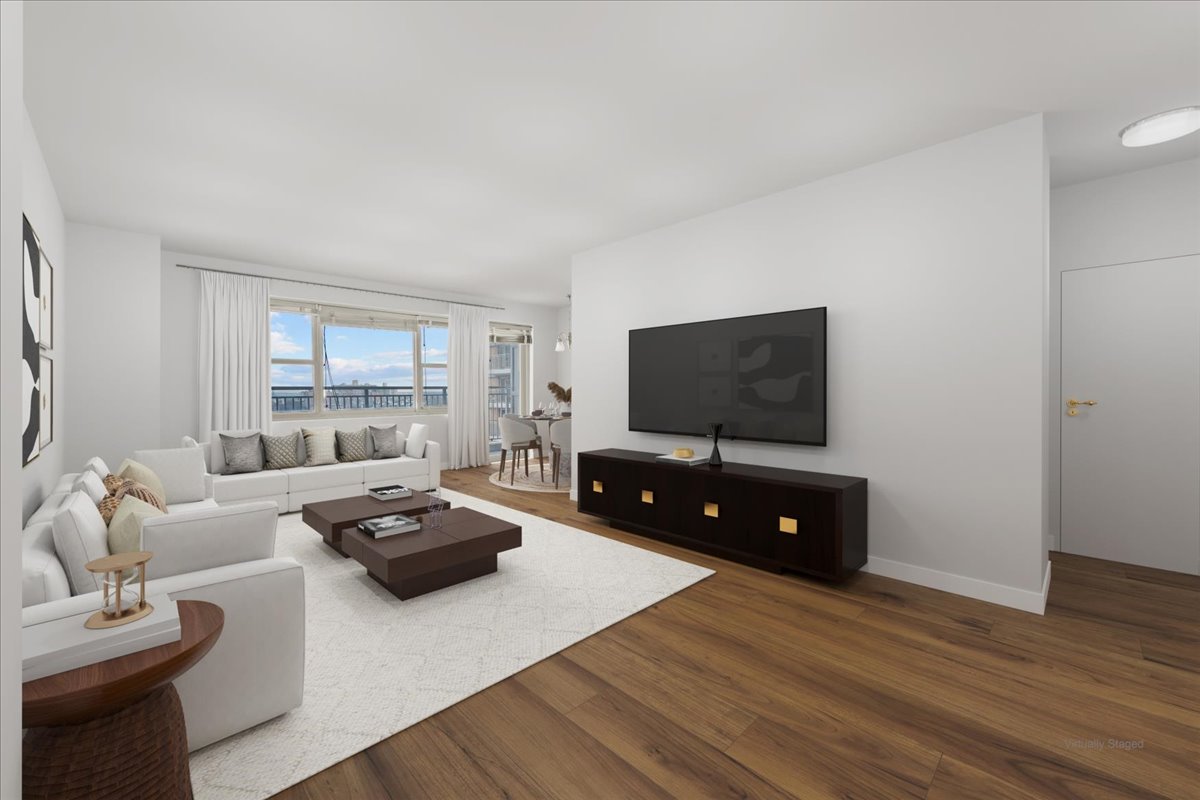 448 Neptune Avenue, Unit 16K Brooklyn, NY 11224 - Photo 4 of 28 a living room with furniture and a flat screen tv