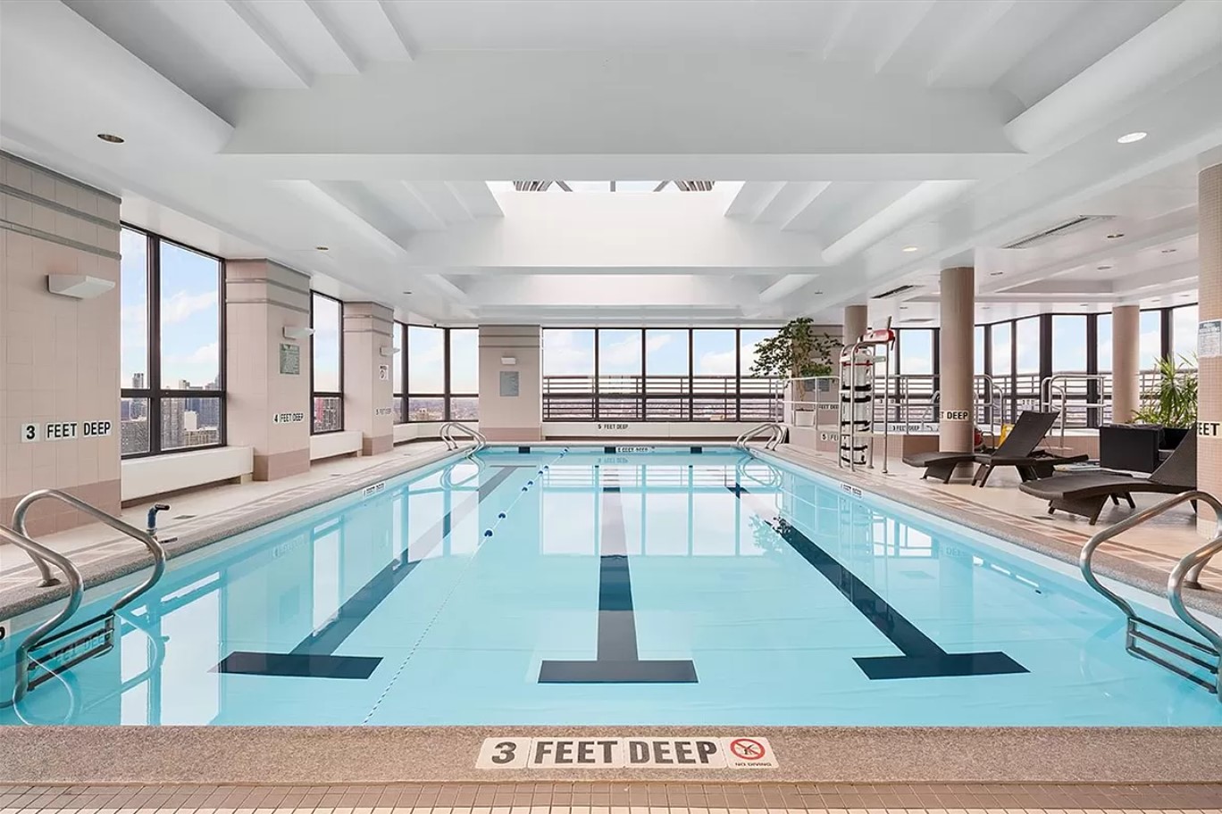 415 East 37th Street, Unit 32G Manhattan, NY 10016 - Photo 17 of 19 a large white kitchen with lots of counter top space
