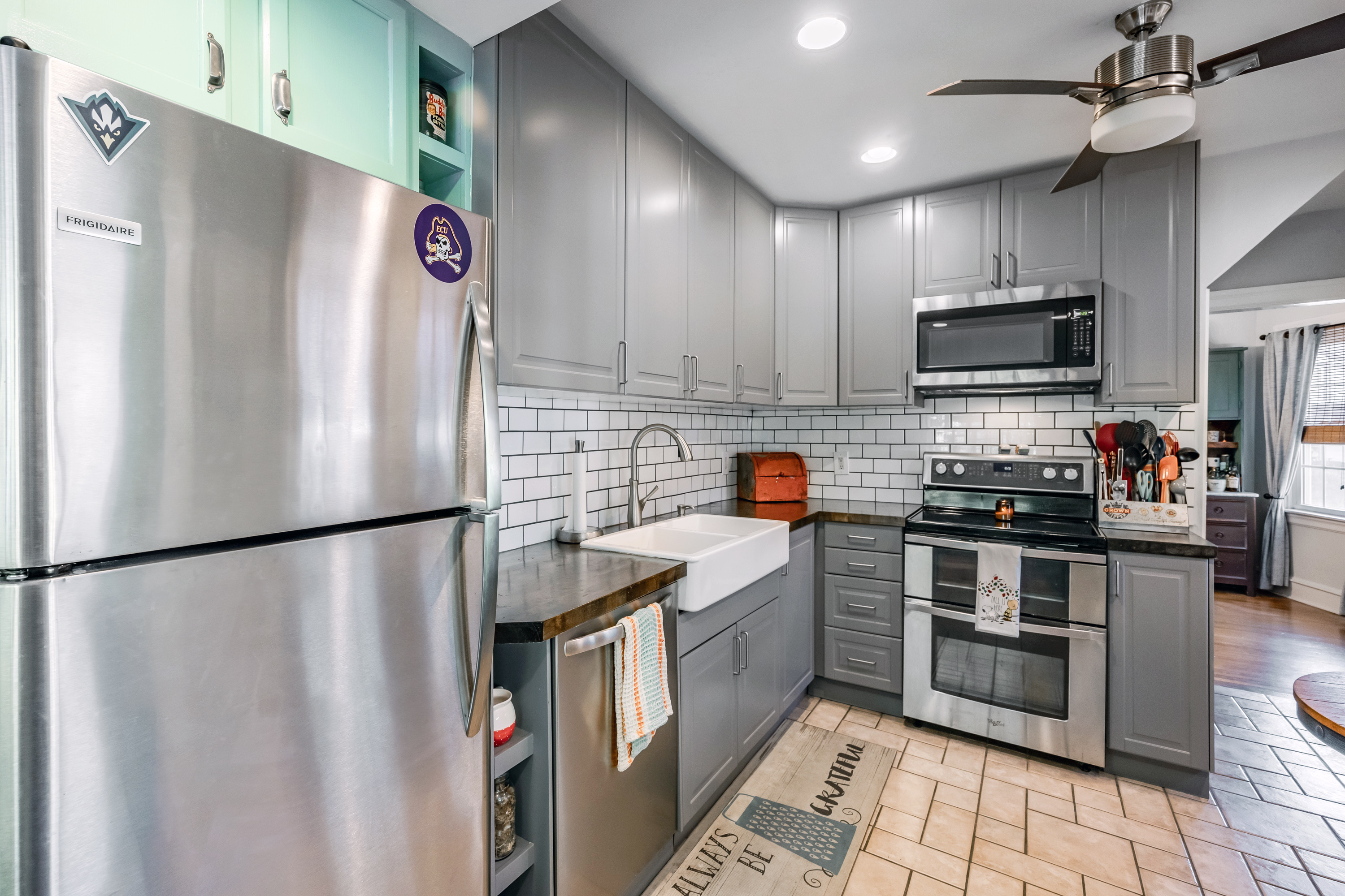 134 Strathmore Road Havertown, PA 19083 - Photo 17 of 64 a kitchen with stainless steel appliances granite countertop a refrigerator a stove a sink and a microwave