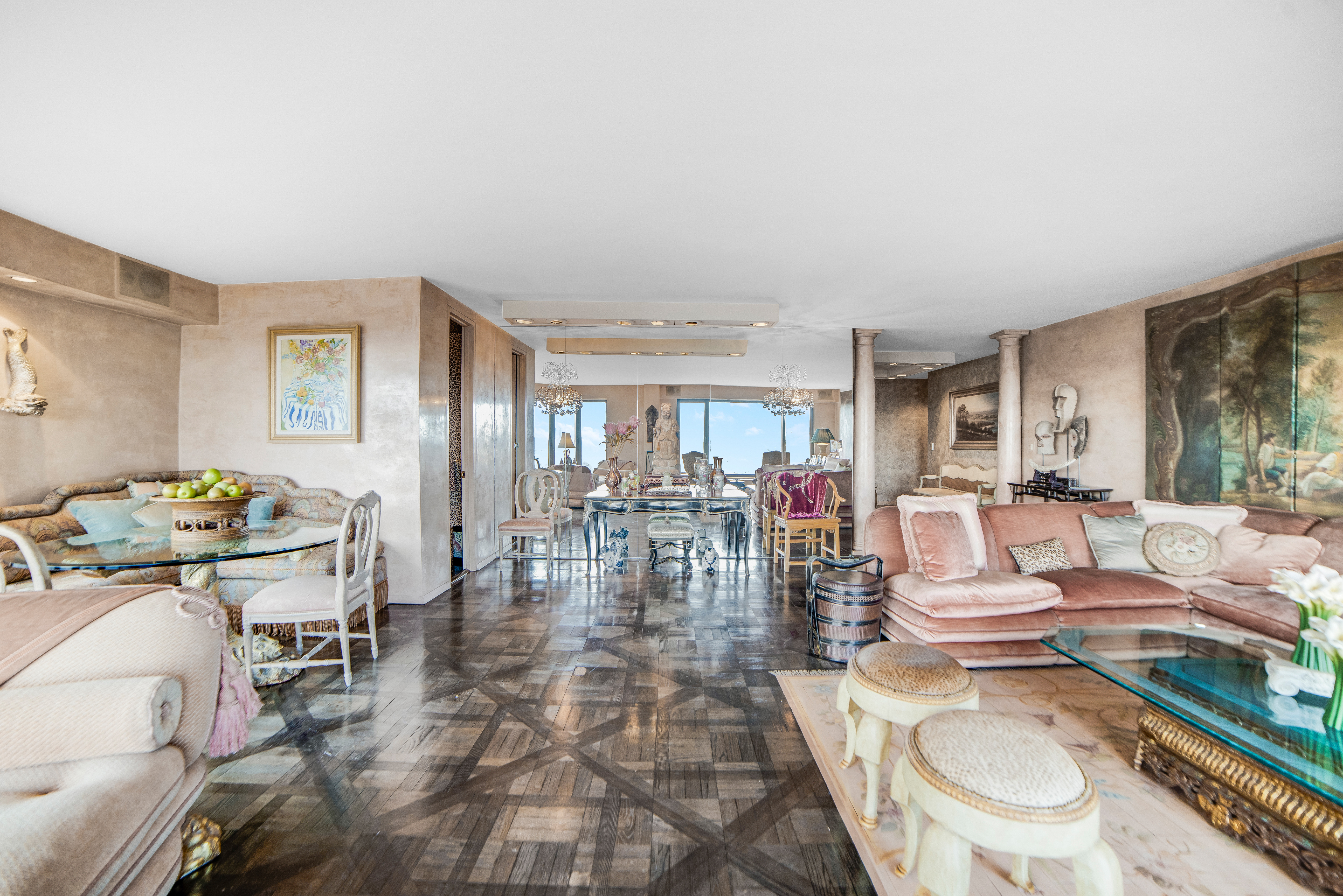 200 Central Park South, Unit 24A Manhattan, NY 10019 - Photo 4 of 23 a living room with furniture and a table