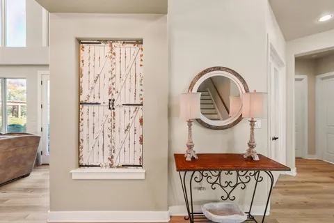 a view of a livingroom with workspace and a window