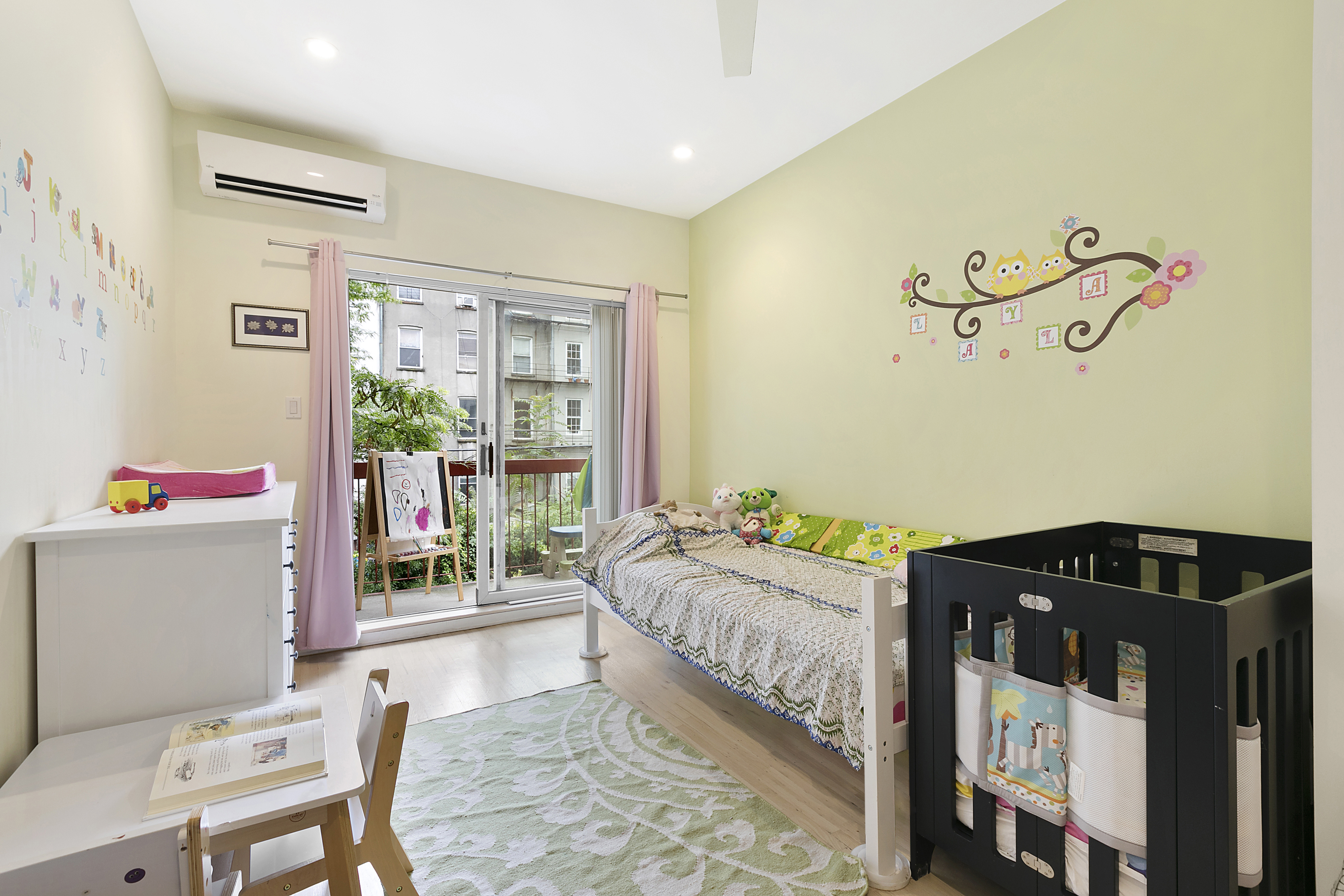 86 Butler Street, Unit 2 Brooklyn, NY 11231 - Photo 7 of 9 a bedroom with a bed and a table in it