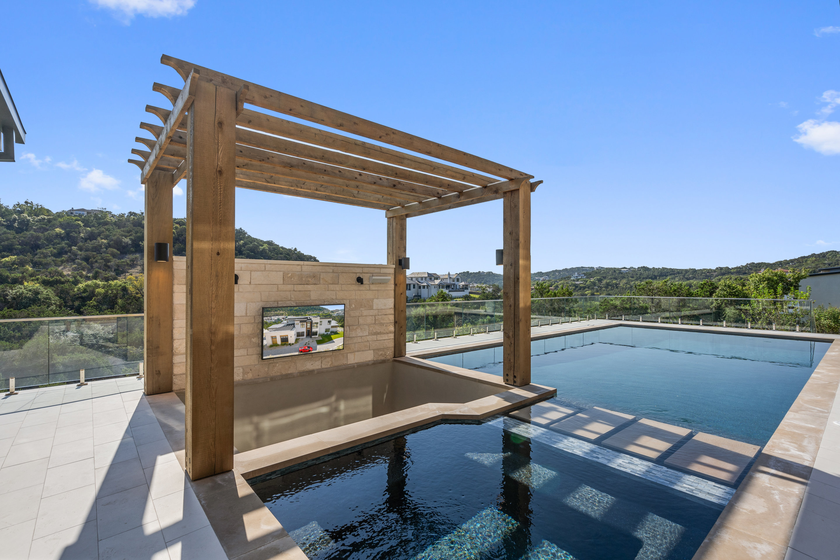 1905 Hallam Drive Austin, TX 78746 - Photo 34 of 39 a view of a balcony with floor to ceiling window with wooden floor