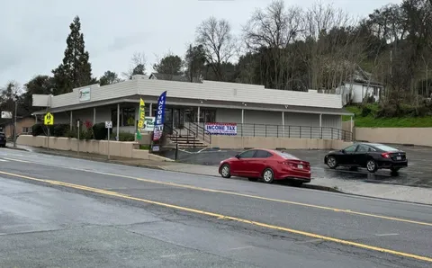 a car parked in front of a house