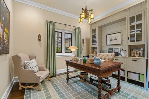 a view of a workspace with furniture and entryway