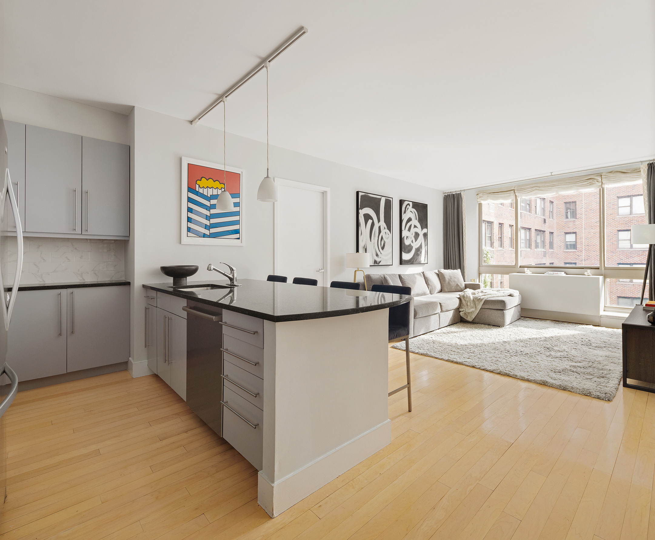 a kitchen with stainless steel appliances granite countertop a sink stove and cabinets