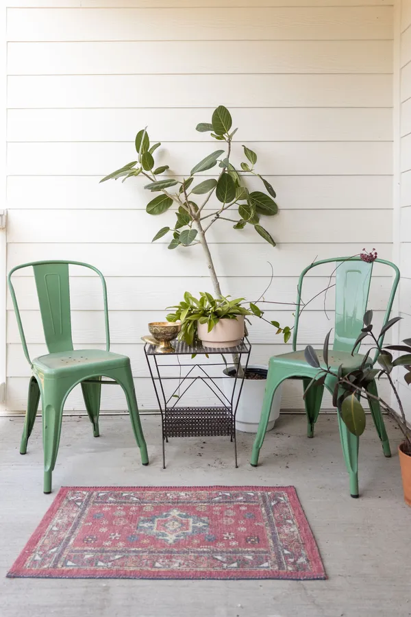 a view of a table and chairs in a patio
