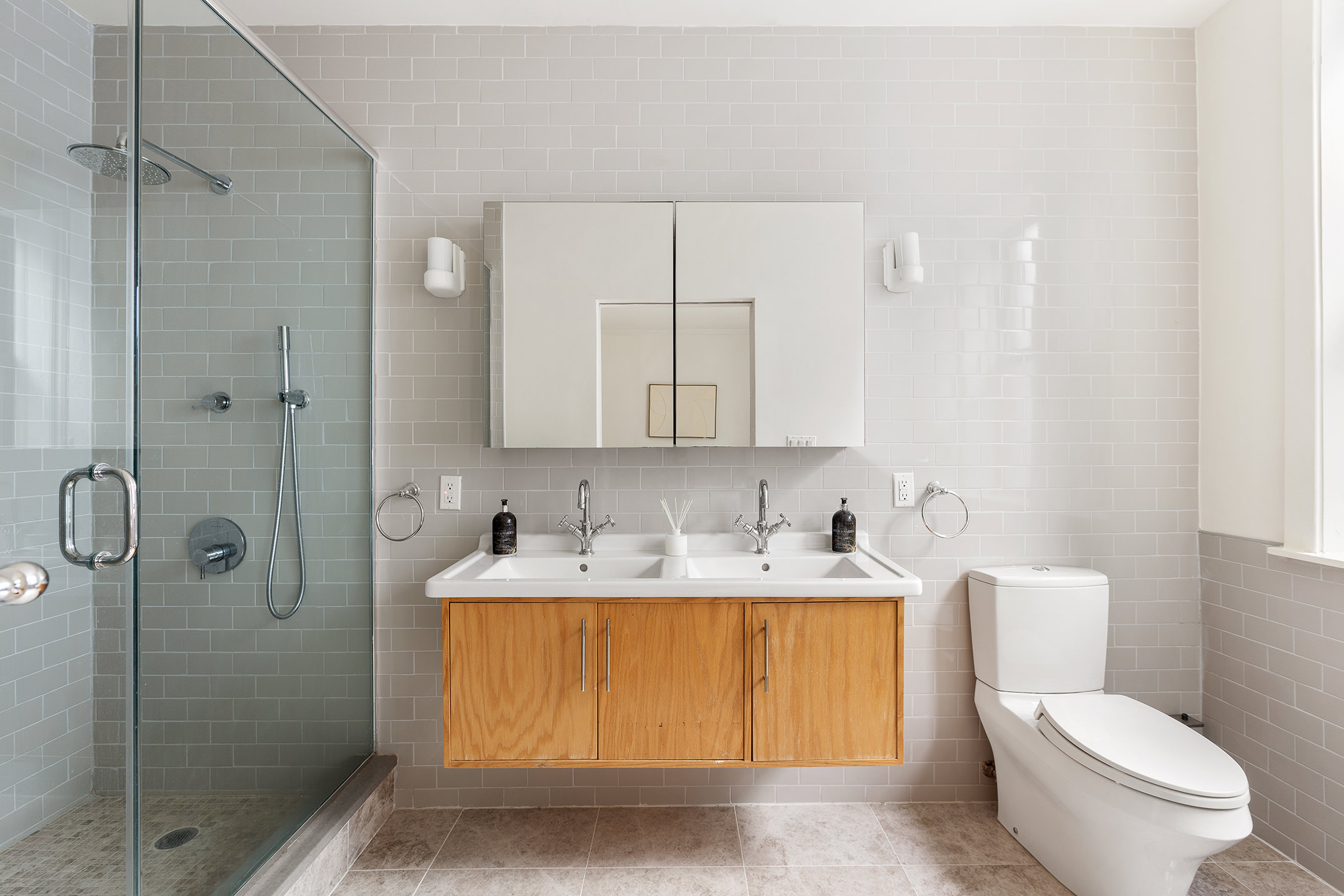 1845 Adam Clayton Powell Jr Boulevard, Unit 5C Manhattan, NY 10026 - Photo 13 of 17 a bathroom with a sink toilet and shower