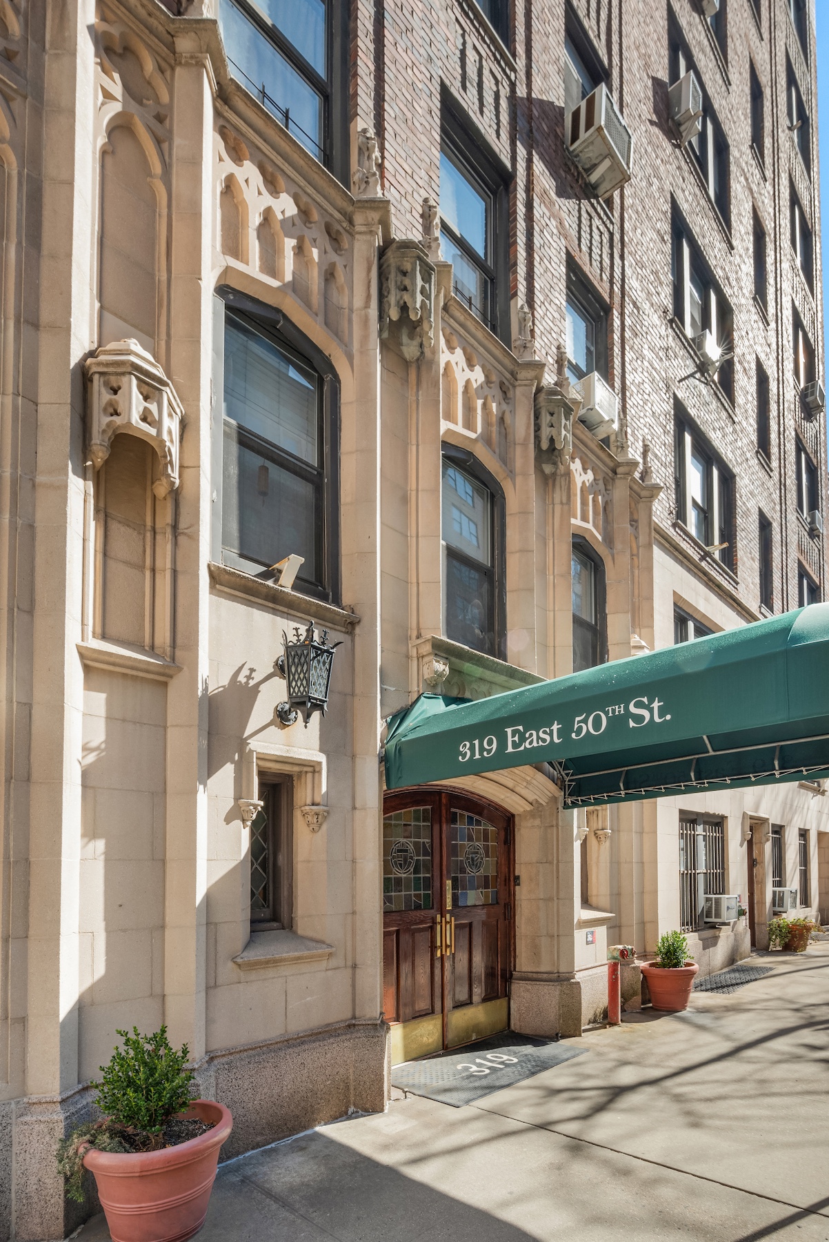 319 East 50th Street, Unit 4H Manhattan, NY 10022 - Photo 7 of 9 a view of a building with a street