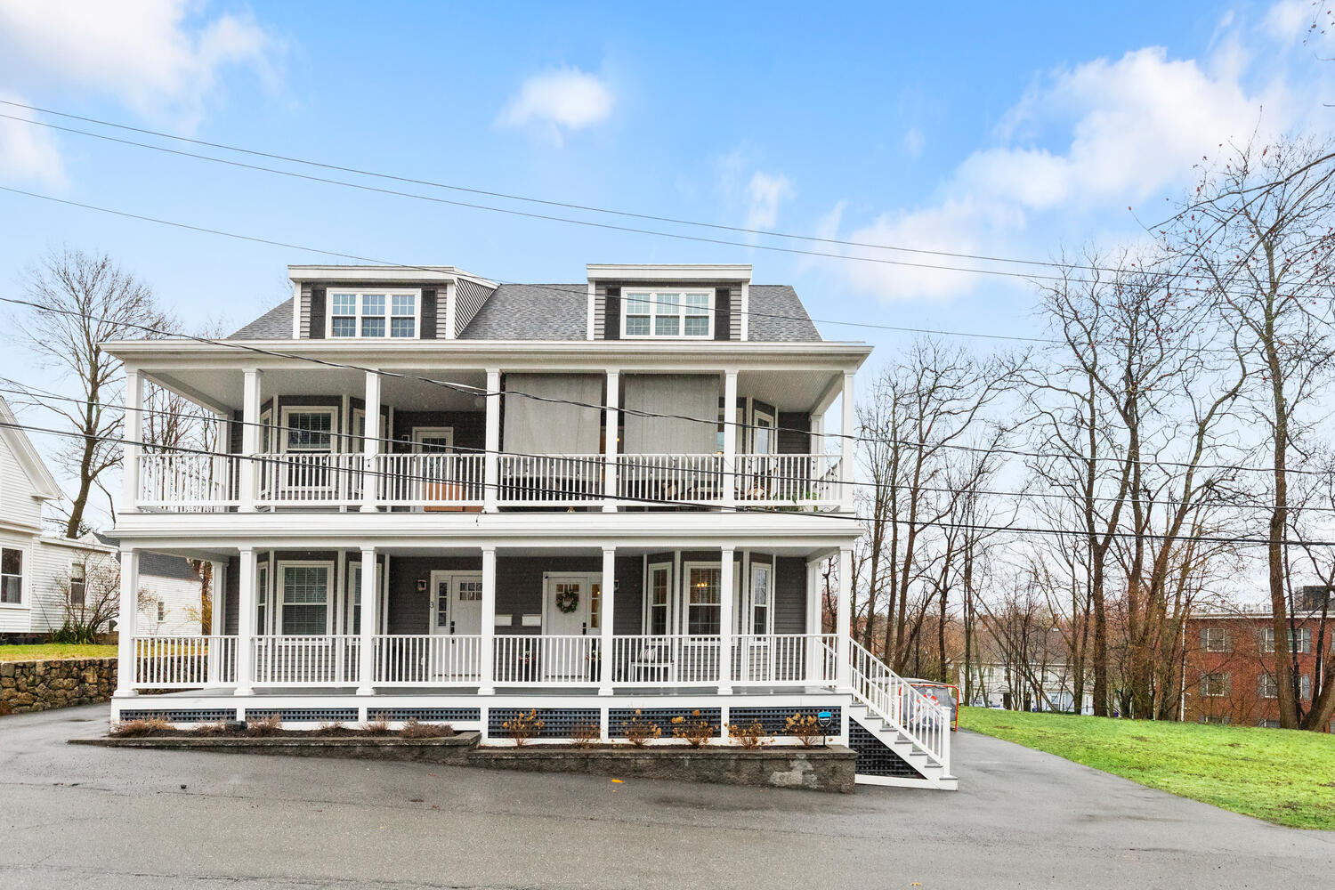 1 Maple Street, Unit 1 Maynard, MA 01754 - Photo 38 of 42 a front view of a building with a garden