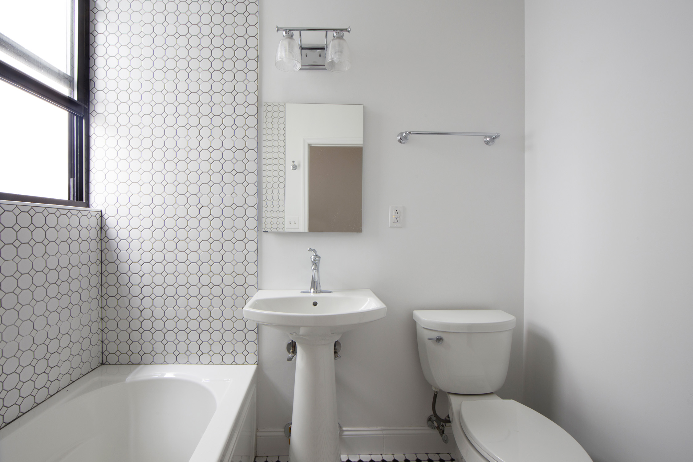 1499 Union Street, Unit 2 Brooklyn, NY 11213 - Photo 5 of 11 a bathroom with a sink a toilet and shower