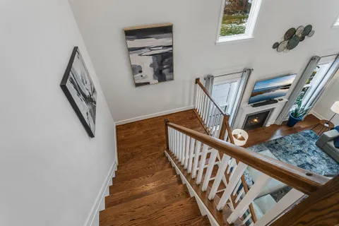 a living room with furniture cabinets and a flat screen tv