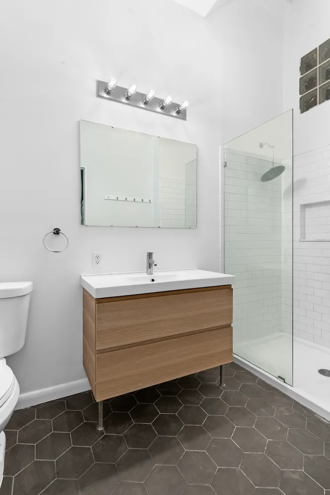 a bathroom with a sink a toilet and bathtub