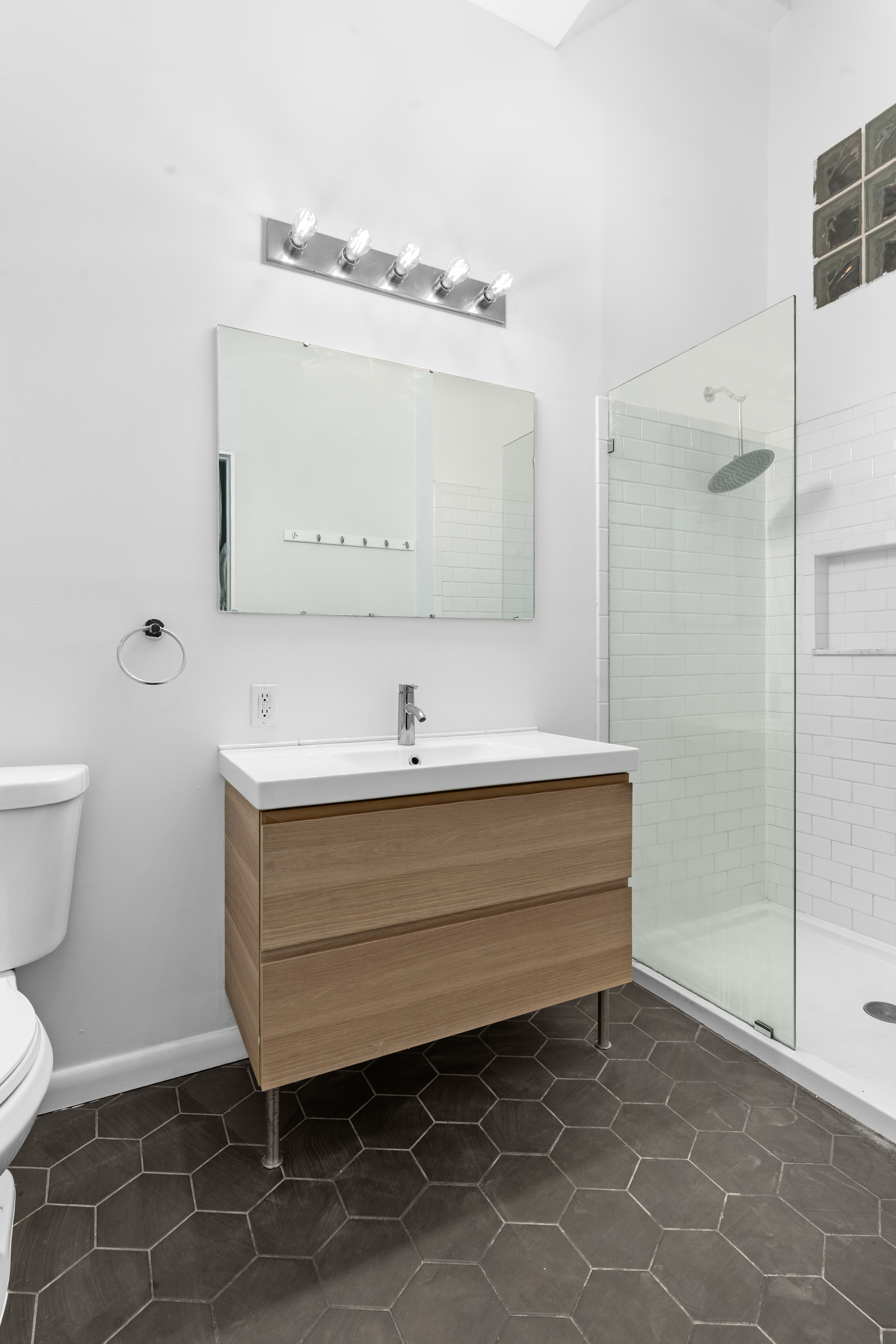 339 East 29th Street Brooklyn, NY 11226 - Photo 17 of 21 a bathroom with a sink and a mirror