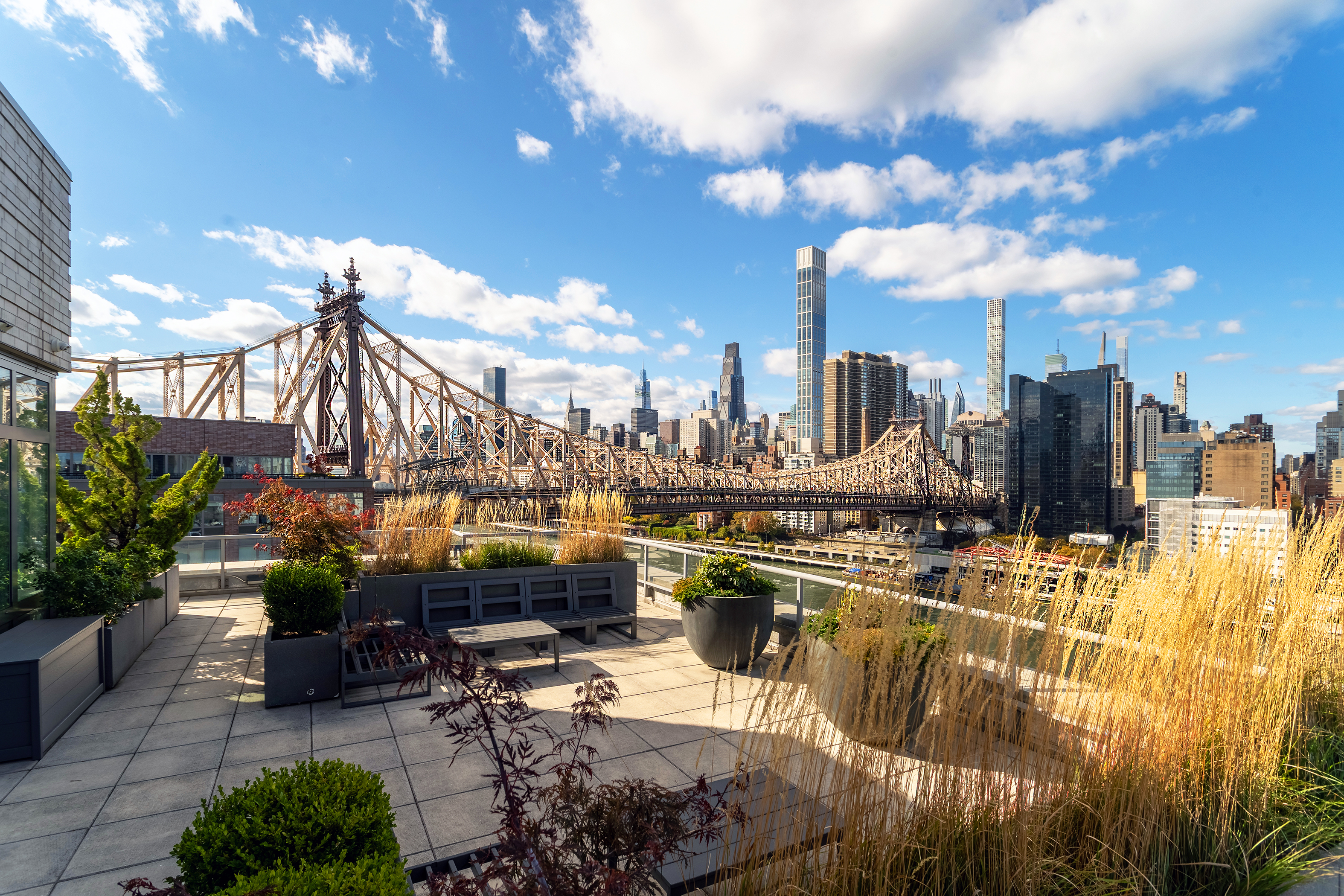 415 Main Street, Unit 7C Manhattan, NY 10044 - Photo 14 of 16 a view of a terrace with chairs