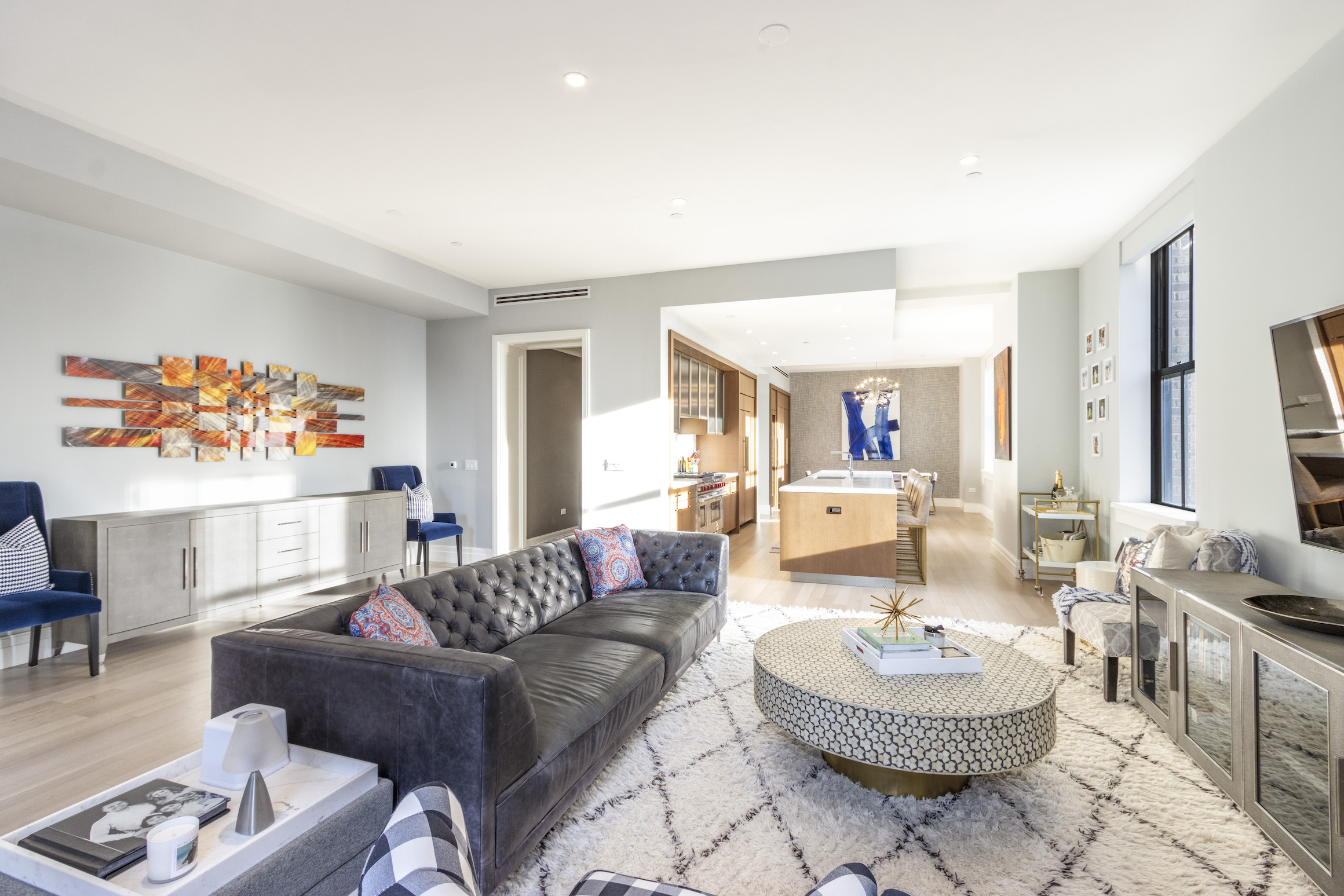 100 Barclay Street, Unit 15P Manhattan, NY 10007 - Photo 2 of 34 a living room with furniture and a table