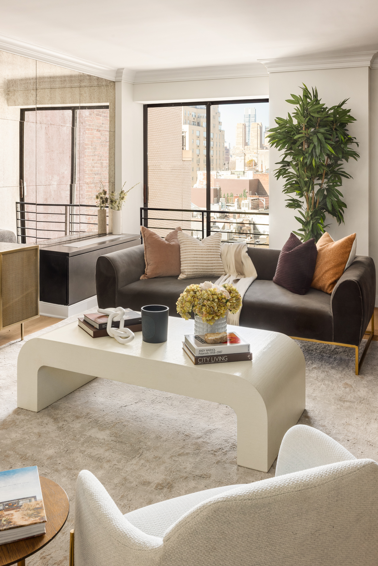 32 East 76th Street, Unit 805 Manhattan, NY 10021 - Photo 2 of 15 a living room with furniture and large windows