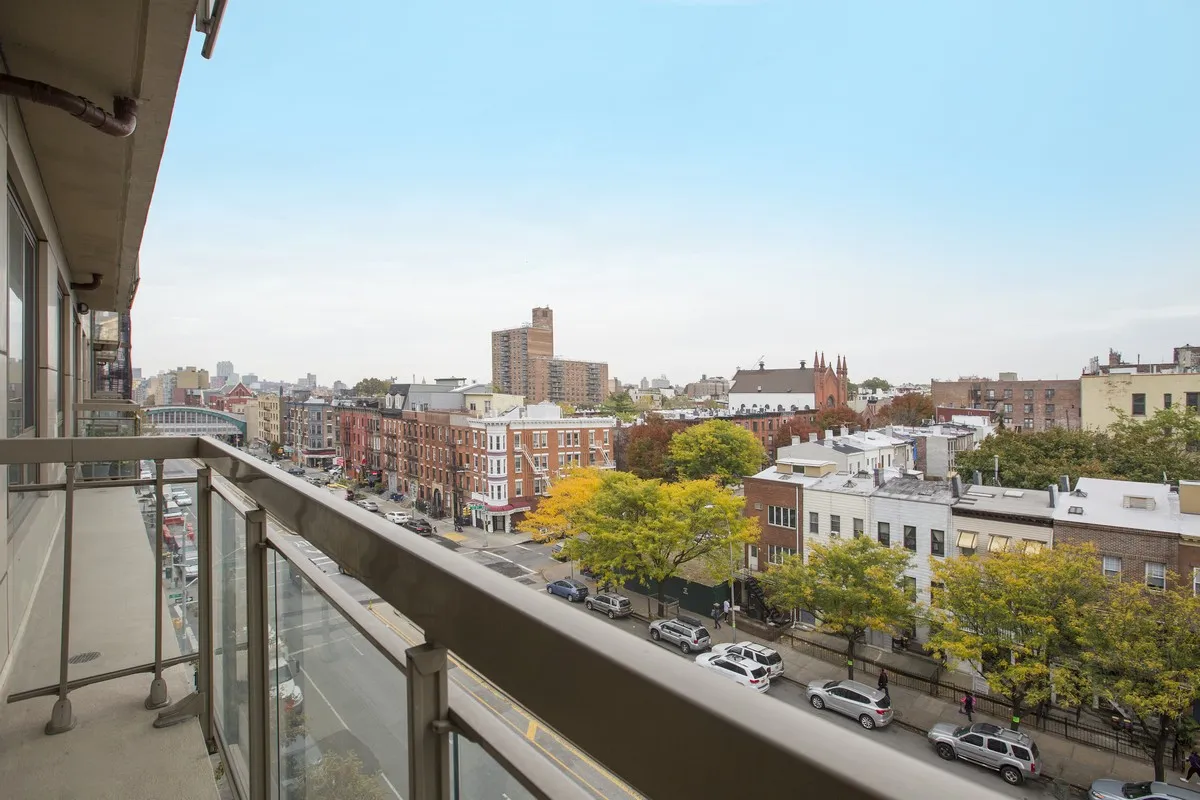 a view of a city skyline from a balcony